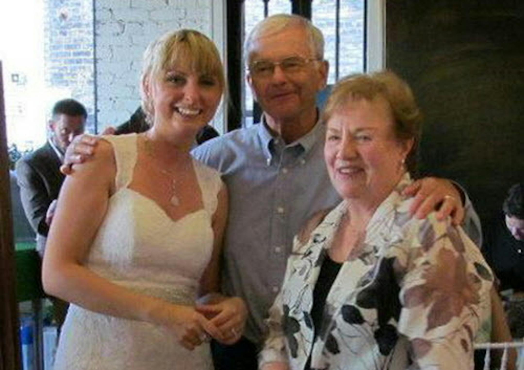 Stela Osmancevic Center with Joan and Ron Cornwell at her wedding in 2012.