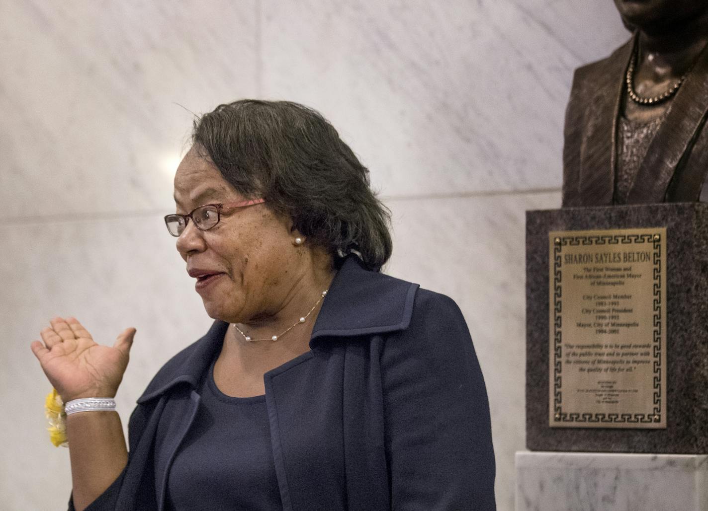 Sharon Sayles Belton reacted after the unveiling of her Bronze Tribute, honoring her achievements during her mayoral terms from 1994 to 2001, and in recognition of her being the first African-American and first woman mayor in the city.