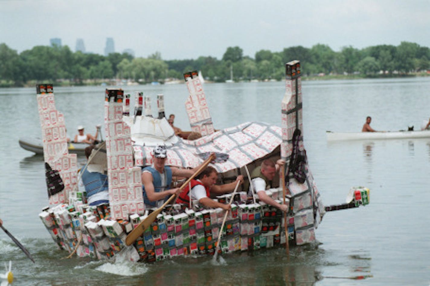 This group of friends from Hamline University competed in the Polka Dot Skipper's Race, also called the Bovine Division of this year's Milk Carton Boat Races.  Entries were to have a cow theme. Named "Belly Up", this boat was made of 1,700 milk cartons and 18 rolls of duct tape.  It took the group three weeks to build.  Belly Up placed second place in the division.