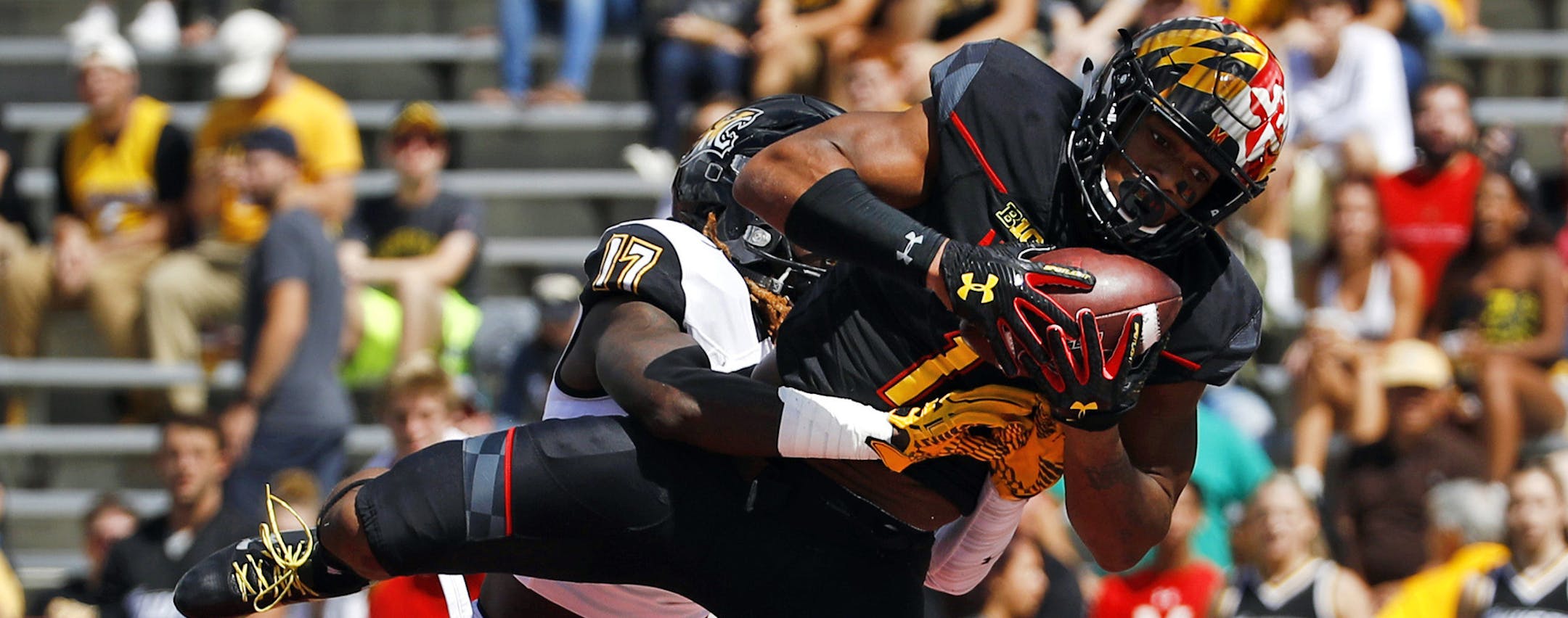 Maryland wide receiver D.J. Moore (1) catches a touchdown pass in front of Towson cornerback Justice Pettus-Dixon in the first half of an NCAA college football game in College Park, Md., Saturday, Sept. 9, 2017. (AP Photo/Patrick Semansky) ORG XMIT: MDPS102