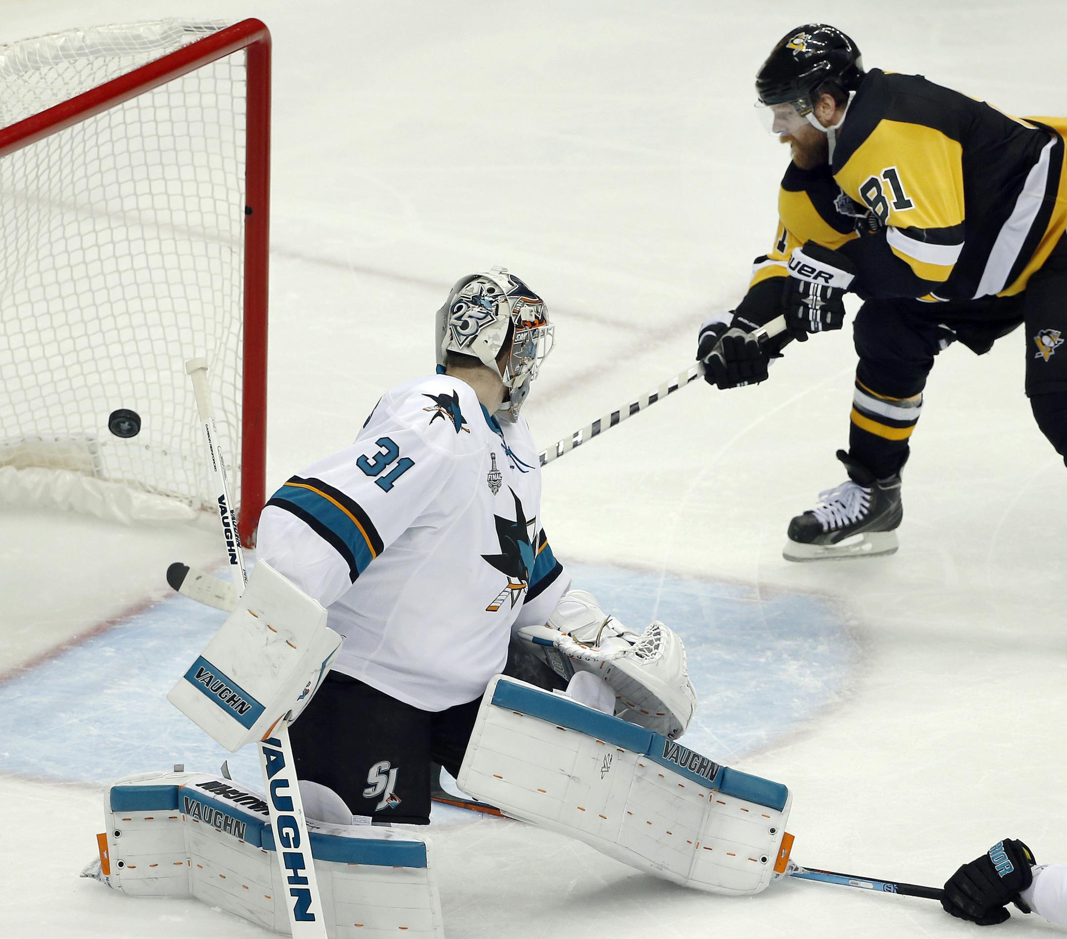 Pittsburgh Penguins' Phil Kessel (81) scores a goal behind San Jose Sharks goalie Martin Jones (31) during the second period in Game 2 of the NHL hockey Stanley Cup Finals on Wednesday, June 1, 2016, in Pittsburgh. (AP Photo/Gene J. Puskar)
