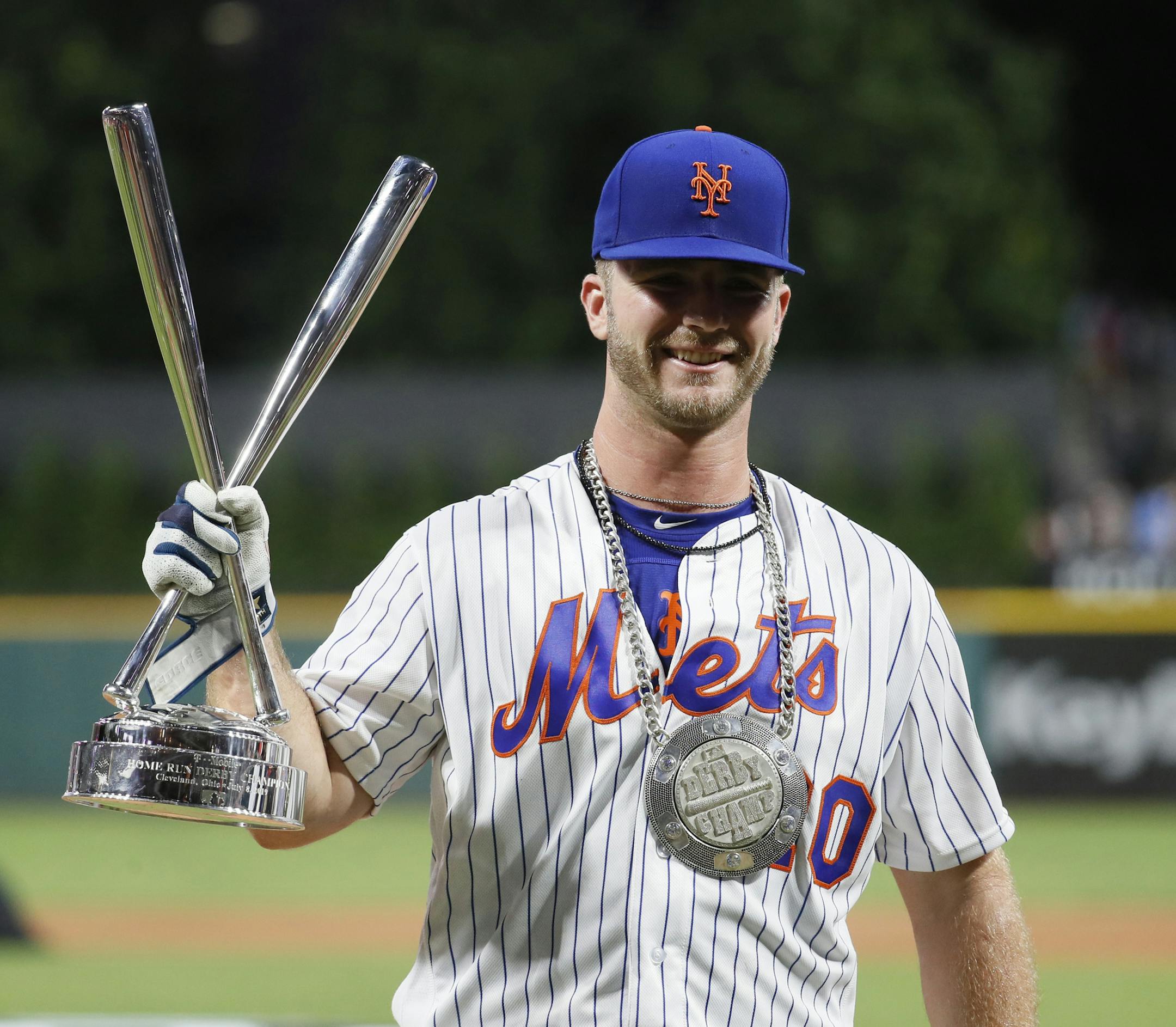 Pete Alonso, of the New York Mets, celebrates winning the Major League Baseball Home Run Derby, Monday, July 8, 2019, in Cleveland. The MLB baseball All-Star Game will be played Tuesday. (AP Photo/John Minchillo)