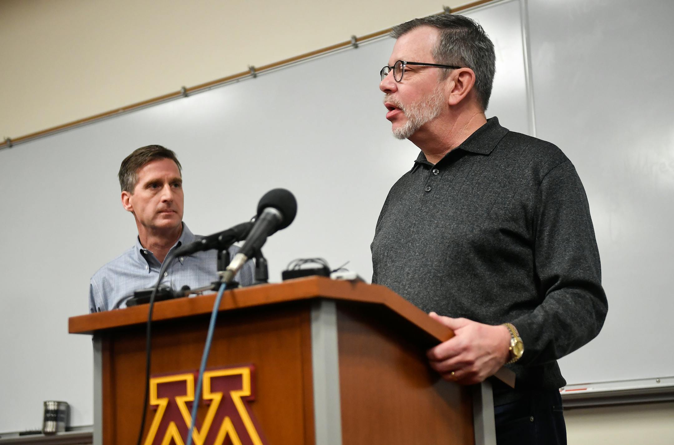 University of Minnesota President Eric Kaler spoke to the media Saturday after players announced the end of their boycott of the Holiday Bowl minutes before as Athletic Director Mark Coyle stood behind. ] (AARON LAVINSKY/STAR TRIBUNE) aaron.lavinsky@startribune.com University of Minnesota President Eric Kaler and Athletic Director Mark Coyle addressed the media at the Gibson-Nagurski Football Complex on Saturday, Dec. 17, 2016 in Minneapolis, Minn. ORG XMIT: MIN1612170957592026