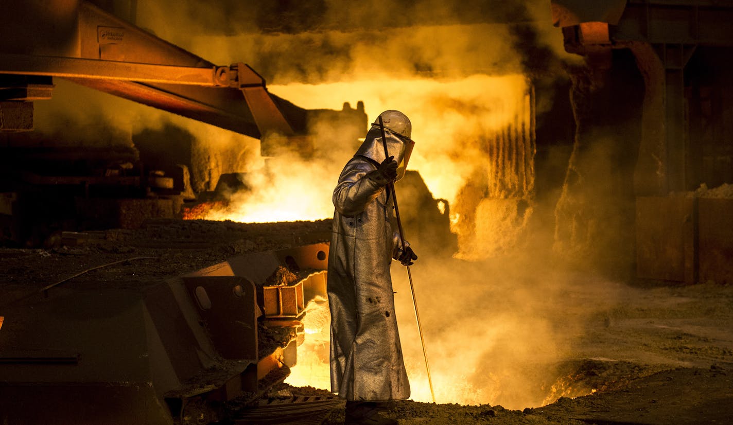 FILE -- A worker checks molten steel at one of the blast furnaces at the ArcelorMittal steelworks in Dunkirk, France, Feb. 18, 2014. The Trump administration announced on May 31, 2018, that it would impose a 25 percent tariff on steel and a 10 percent tariff on aluminum from the European Union, Canada and Mexico, which supply nearly half of America&#x2019;s imported metal. (Andrew Testa/The New York Times)