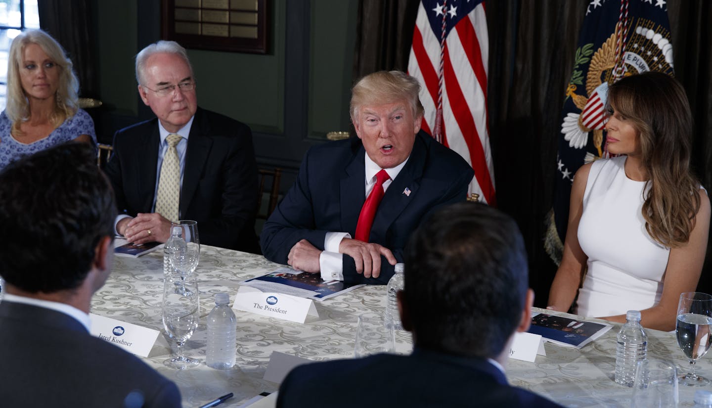 President Donald Trump speaks during a briefing on the opioid crisis, Tuesday, Aug. 8, 2017, at Trump National Golf Club in Bedminster, N.J. From left are, White House senior adviser Kellyanne Conway, Health and Human Services Secretary Tom Price, Trump, and first lady Melania Trump. (AP Photo/Evan Vucci)