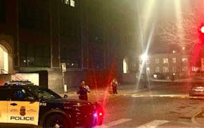 Police seal off an area Wednesday night where two people were run over at an intersection in south Minneapolis.