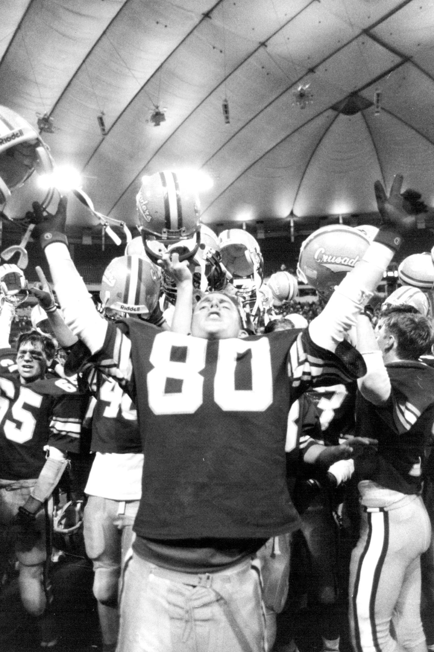 November 29, 1992 A looooooooooong day at the Dome — St. Cloud Cathedral's Eric Over man (80) led the celebration after his Crusaders rallied in the final minute for a 7-6 victory over BOLD in the Class B championship game of Friday's Prep Bowl XI at the Metro dome. The other champions : Lakeville in Class AA, Detroit Lakes in Class A, Mahnomen in class C and Stephen in Nine-man. Bruce Bisping, Minneapolis Star Tribune