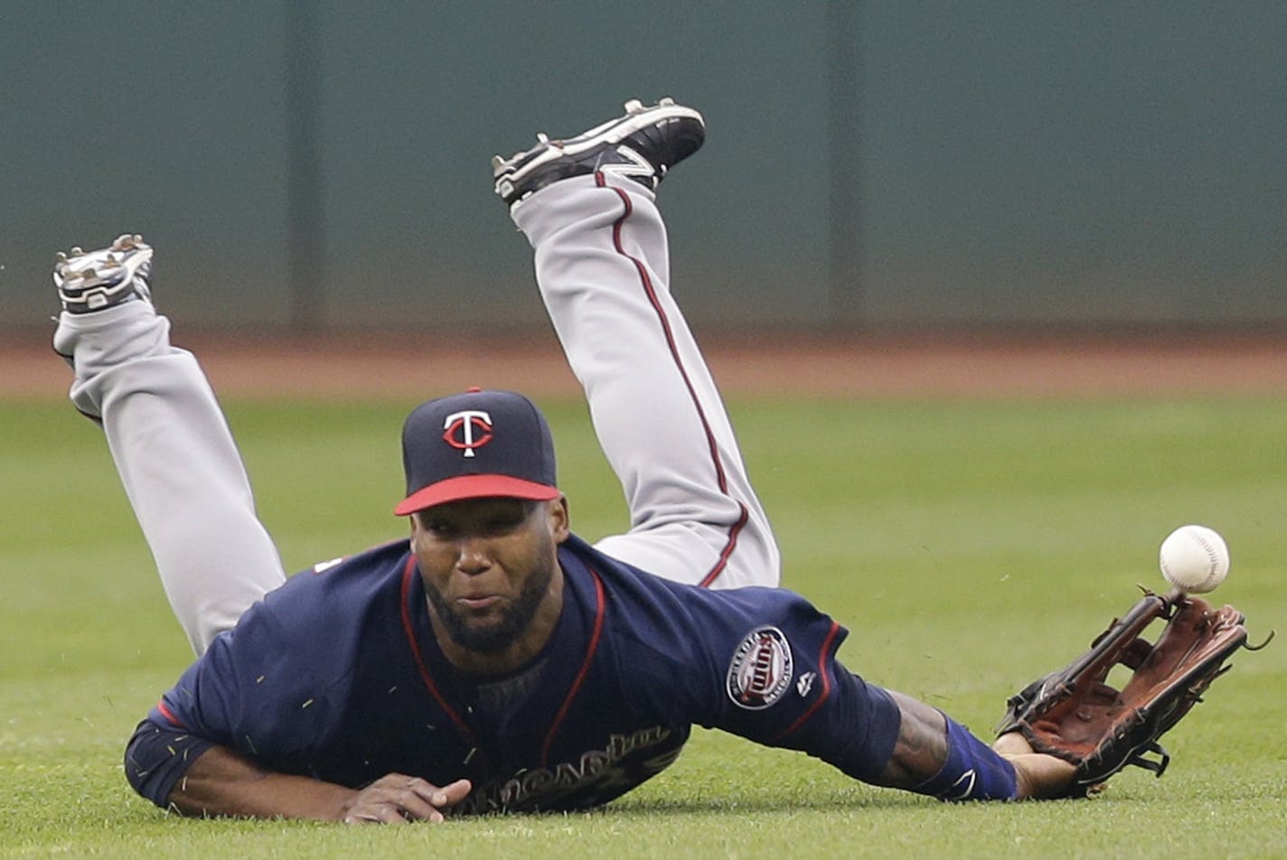 Minnesota Twins' Danny Santana can't get to a double hit by Cleveland Indians' Jose Ramirez during the second inning of a baseball game Friday, May 13, 2016, in Cleveland. (AP Photo/Tony Dejak)