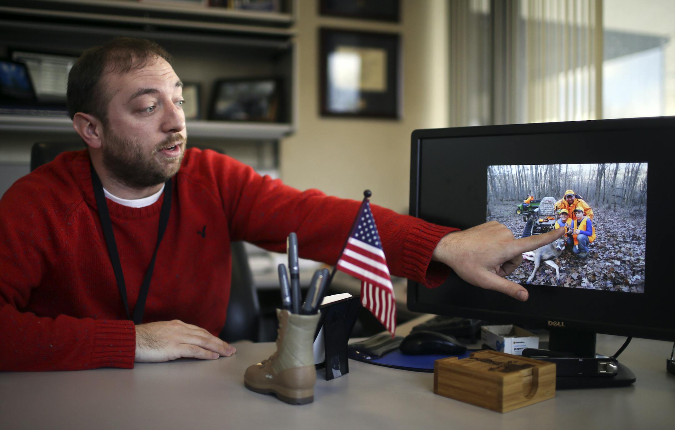 John Kriesel, the director of the Anoka County Veteran Services Office, was seen in his office with an image of his sons and himself deer hunting last season, something Kriesel said he never imagined possible following his injury and now something he said he "cherishes." Many of the county VA offices are staffed by vets who have gone through some of the things vets arriving back home after a war deployment are feeling. "When people come in here, they are in good hands," Kriesel said, from his of