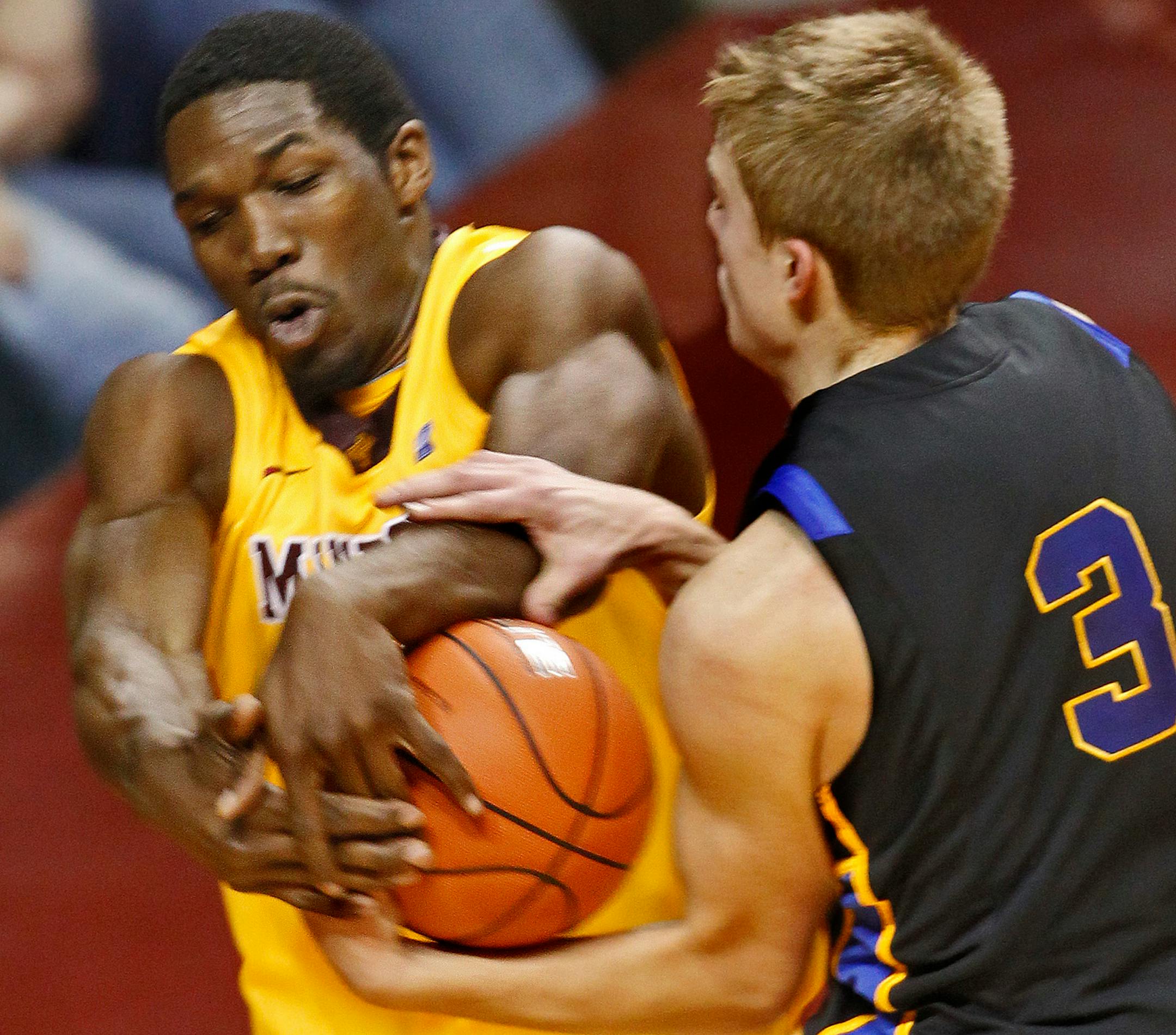 Gophers Trevor Mbakwe, left fought for control of a rebound against SDSU's Nate Wolters (3) last season.