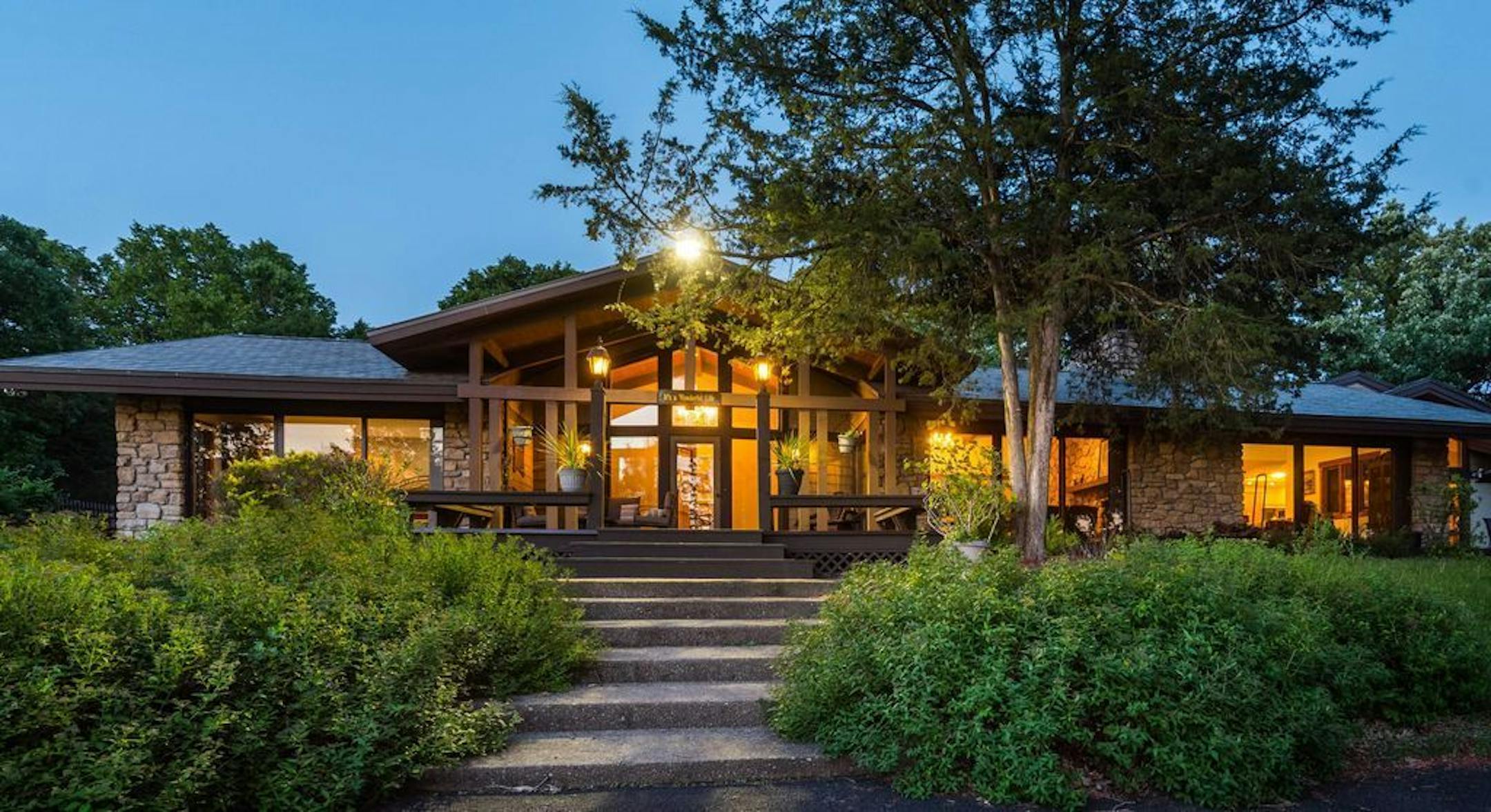 Front entry of Grey Cloud Island property, which boasts five bedrooms, swimming pool and serene setting only 13 miles from St. Paul