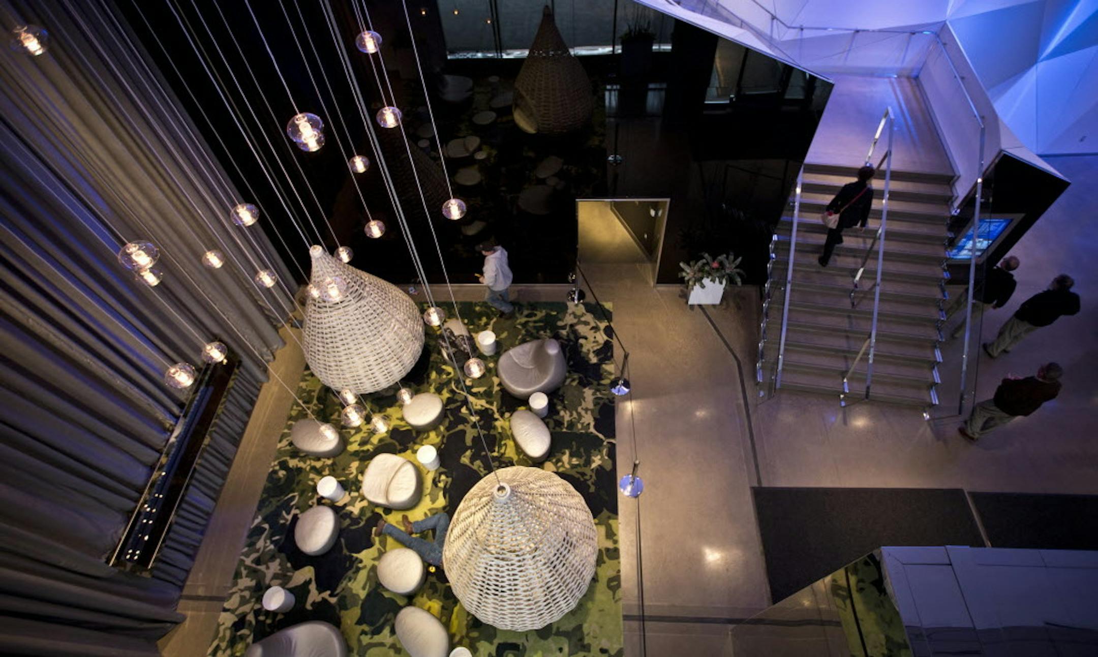 A lounge in the lobby has swings and a topographic map rug of the area at the new Radisson Blu at the Mall of America on Friday, March 15, 2013, in Bloomington, Minn. The Radisson Blu cost $137 million, has 500 rooms and is connected to the Mall of America through a skyway. ] (RENEE JONES SCHNEIDER * reneejones@startribune.com)