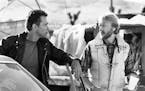 Arnold Schwarzenegger, I., and James Cameron, the film's producer, director and co-writer, discuss a scene in "Terminator 2: Judgment Day," a Tri-Star