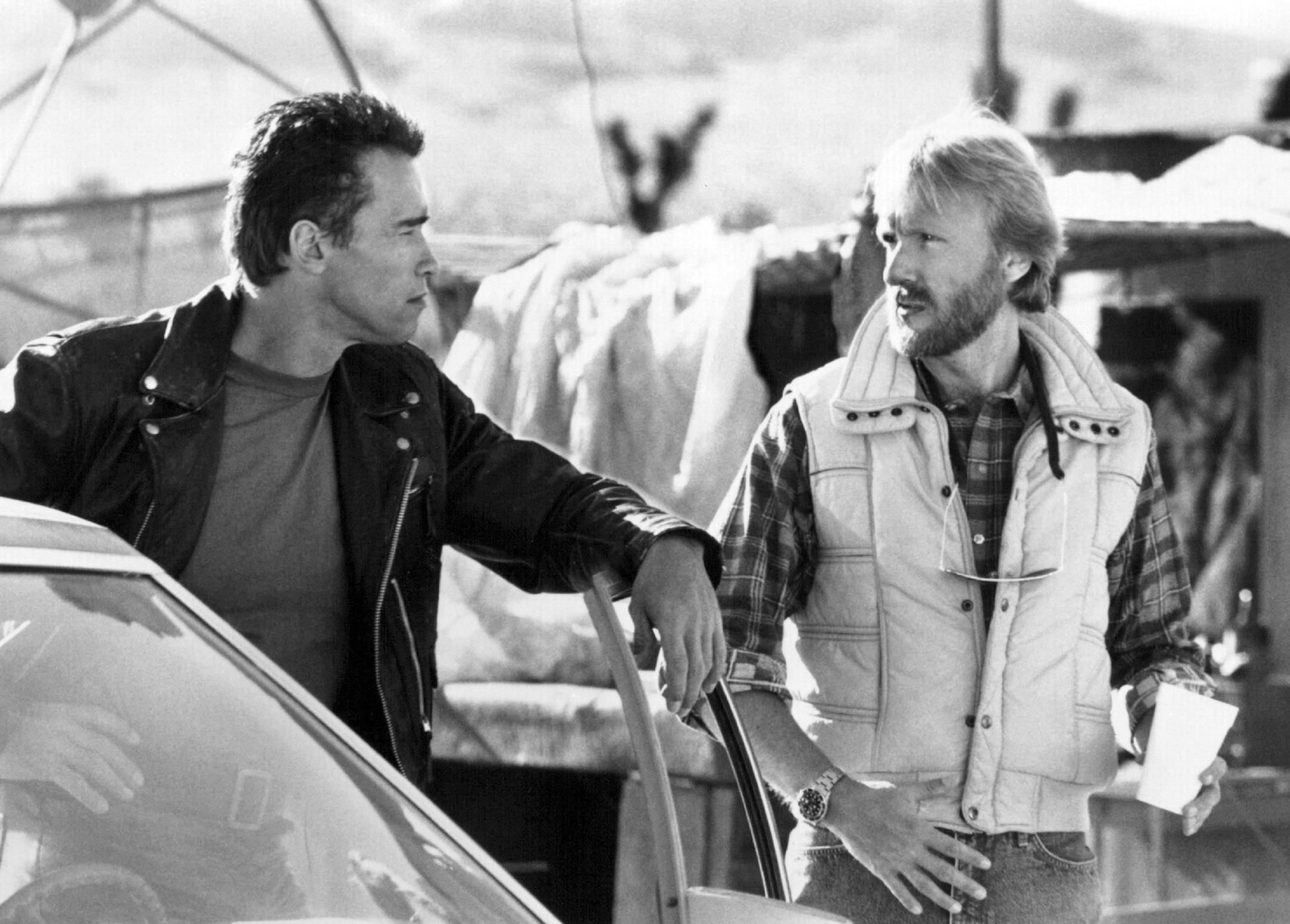 Arnold Schwarzenegger, I., and James Cameron, the film's producer, director and co-writer, discuss a scene in "Terminator 2: Judgment Day," a Tri-Star Pictures release from Carolco. Tri-Star Pictures. Inc.