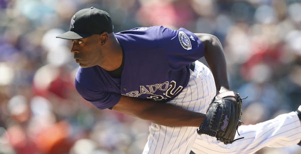 Colorado Rockies relief pitcher LaTroy Hawkins works against the Houston Astros in the sixth inning of an interleague baseball game Thursday, June 18,