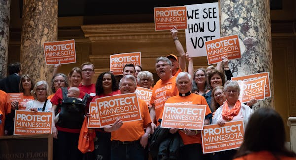 Members of the group Protect Minnesota stood outside the Senate Chambers as Senators entered. The group is calling for sensible gun laws at the Capito
