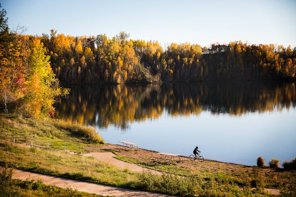 A biker rides near the Rally Center at Cuyuna Country State Recreation Area in 2017. Former mines in that area are among the deepest lakes in the stat