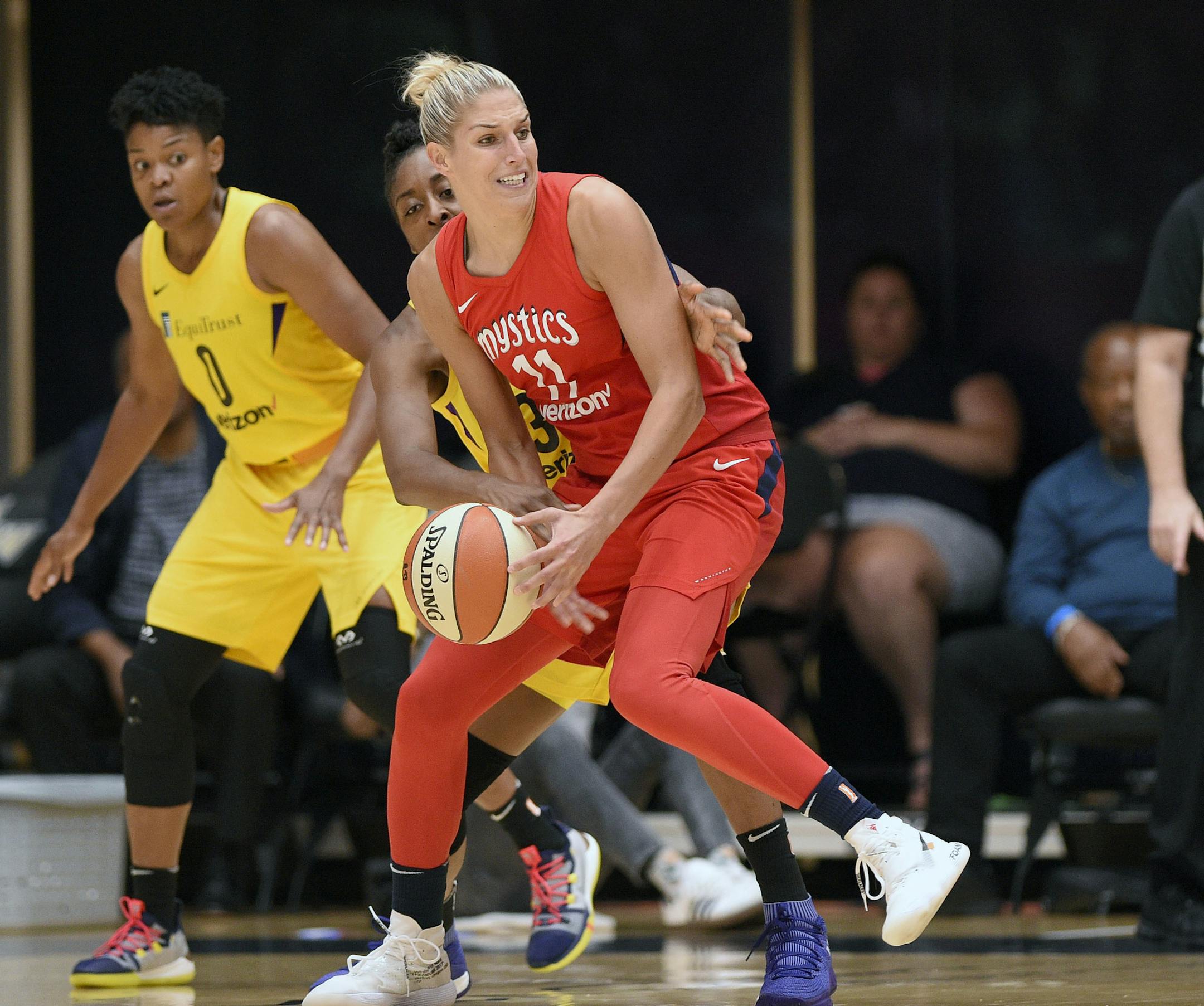 Los Angeles Sparks forward Nneka Ogwumike, center back, and Los Angeles Sparks guard Alana Beard (0) battle for the ball against Washington Mystics guard Elena Delle Donne (11) in the second half of a single elimination WNBA basketball playoff game, Thursday, Aug. 23, 2018, in Washington. The Mystics won 96-64. (AP Photo/Nick Wass)