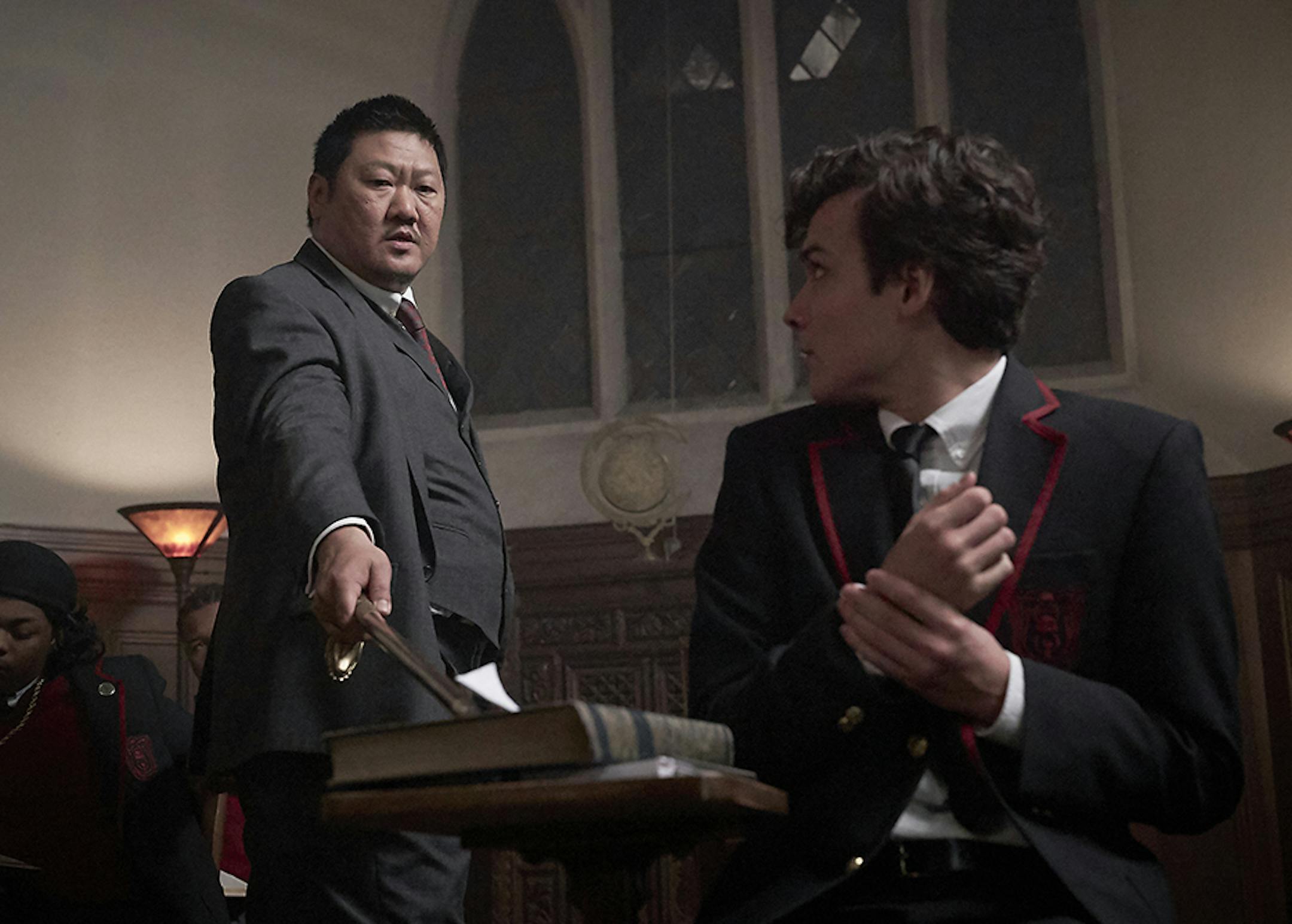 Master Lin (Benedict Wong, standing) inducts Marcus (Benjamin Wadsworth) into a private high school specializing in assassination in Syfy's "Deadly Class." (Allen Fraser/Syfy)