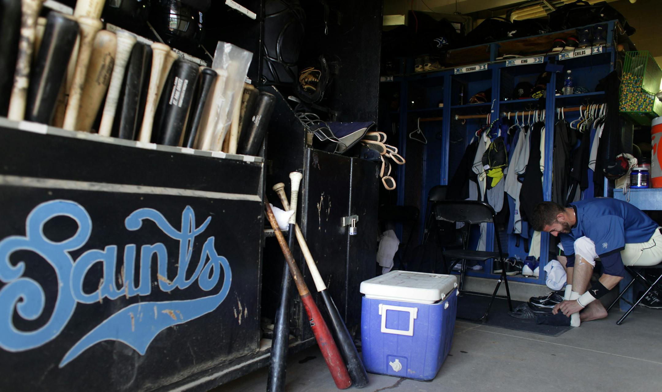 Dwight Childs, of the St. Paul Saints, prepares for the game in the clubhouse before the start of the game against the Sioux city Explorers at Midway stadium on Thursday afternoon.] The St. Paul Saints are wrapping up their final season at Midway stadium. Thursday afternoon they played the Sioux City Explorers at home. MONICA HERNDON monica.herndon@startribune.com St. Paul, MN 08/07/14