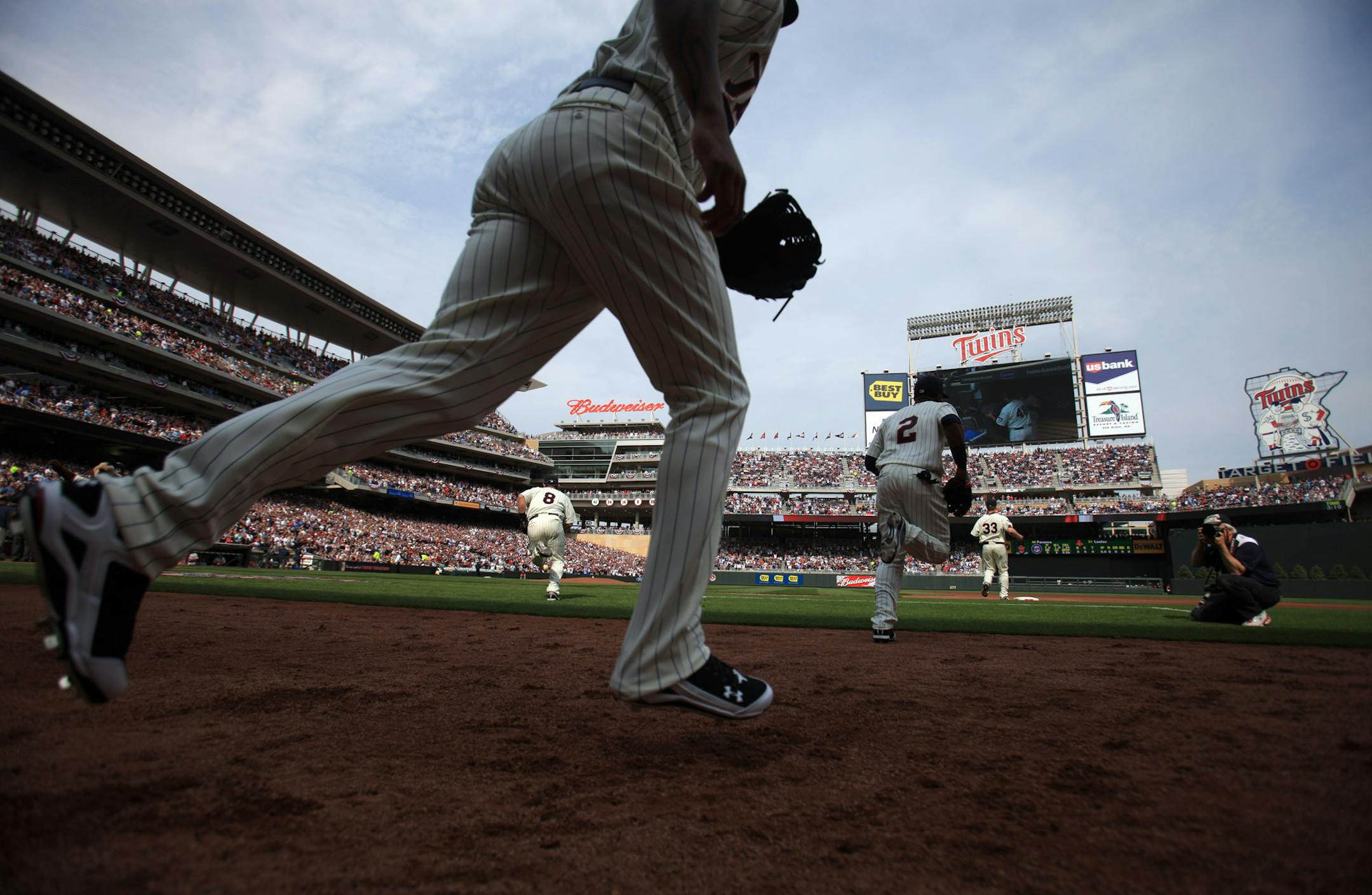 Jeff Wheeler • startribune.com Mpls, MN 4/12/2010 ] Twins take to the field for their home opener against Boston at the new Target Field