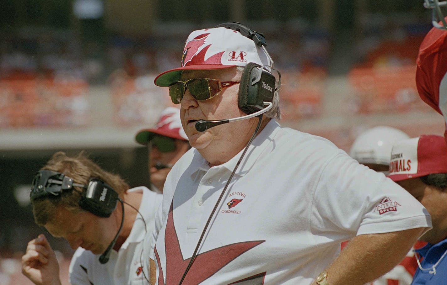 FILE - In this Sept. 4, 1994, file photo, Arizona Cardinals head coach Buddy Ryan watches his team during the first quarter of a game against the Los Angeles Rams in Anaheim, Calif. Buddy Ryan took a back seat to no one. Neither did his fierce defenses that won two Super Bowls. The pugnacious coach and defensive mastermind whose twin sons have been successful NFL coaches, died Tuesday, June 28, 2016. He was 82. (AP Photo/Kevork Djansezian)