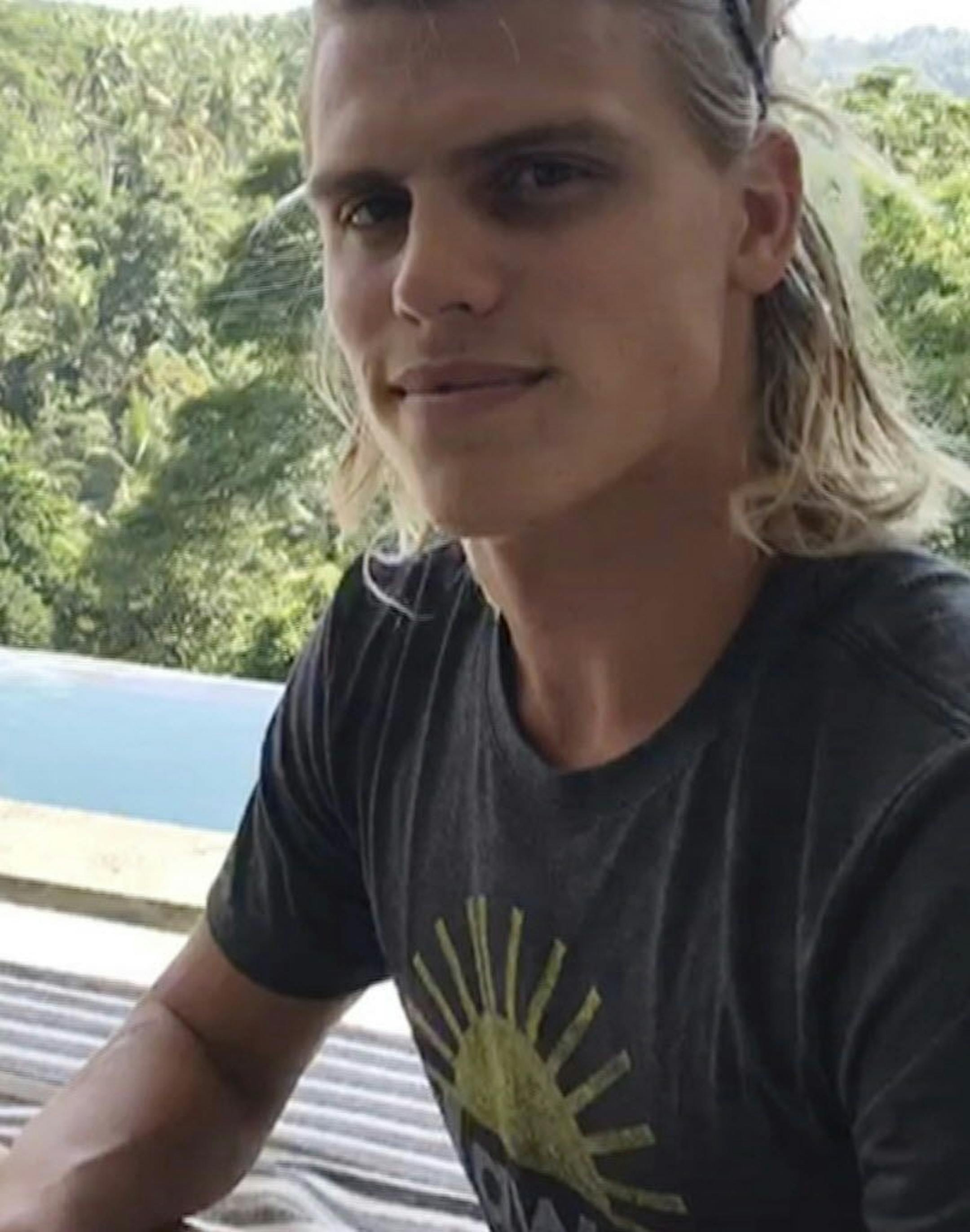 In this July 23, 2018, image made from video, Koa Smith, while in Bali, Indonesia, talks about his two-minute journey on a surfboard off the coast of Africa. Smith rode a wave for nearly a mile and stayed upright as he traveled through eight barrels--the hollow formed by the curve of the wave as it breaks over the surfer's head.