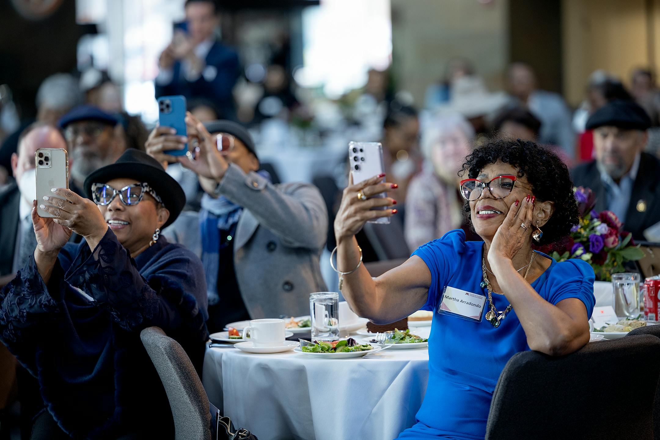 Martha Arrandondo, right, takes video of Josie R. Johnson as she addresses a large crowd during a ceremony in Johnson's honor.