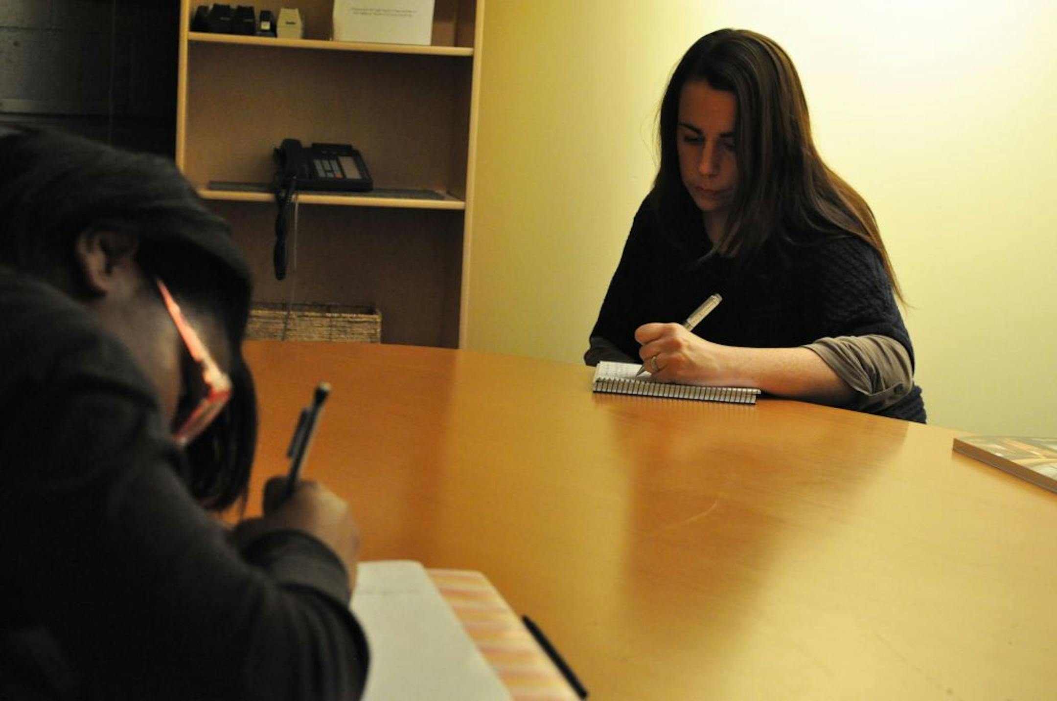 Photos by Liz Rolfsmeier
In a class at Intermedia Arts in Minneapolis, author Susan Niz of Eagan conducted a creative writing exercise with Eleise Devine, 14, of North Minneapolis.
