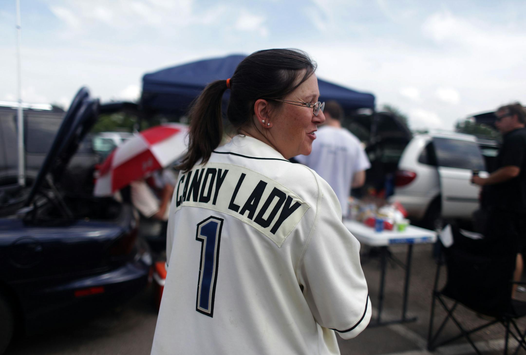 Michelle Quinlan, also know as the "Candy lady" tailgates outside of Midway stadium before the start of the Saints game against the Sioux City Explorers on Thursday morning. Quinlan has been a season ticket holder since 1993. ] The St. Paul Saints are wrapping up their final season at Midway stadium. Thursday afternoon they played the Sioux City Explorers at home. MONICA HERNDON monica.herndon@startribune.com St. Paul, MN 08/07/14