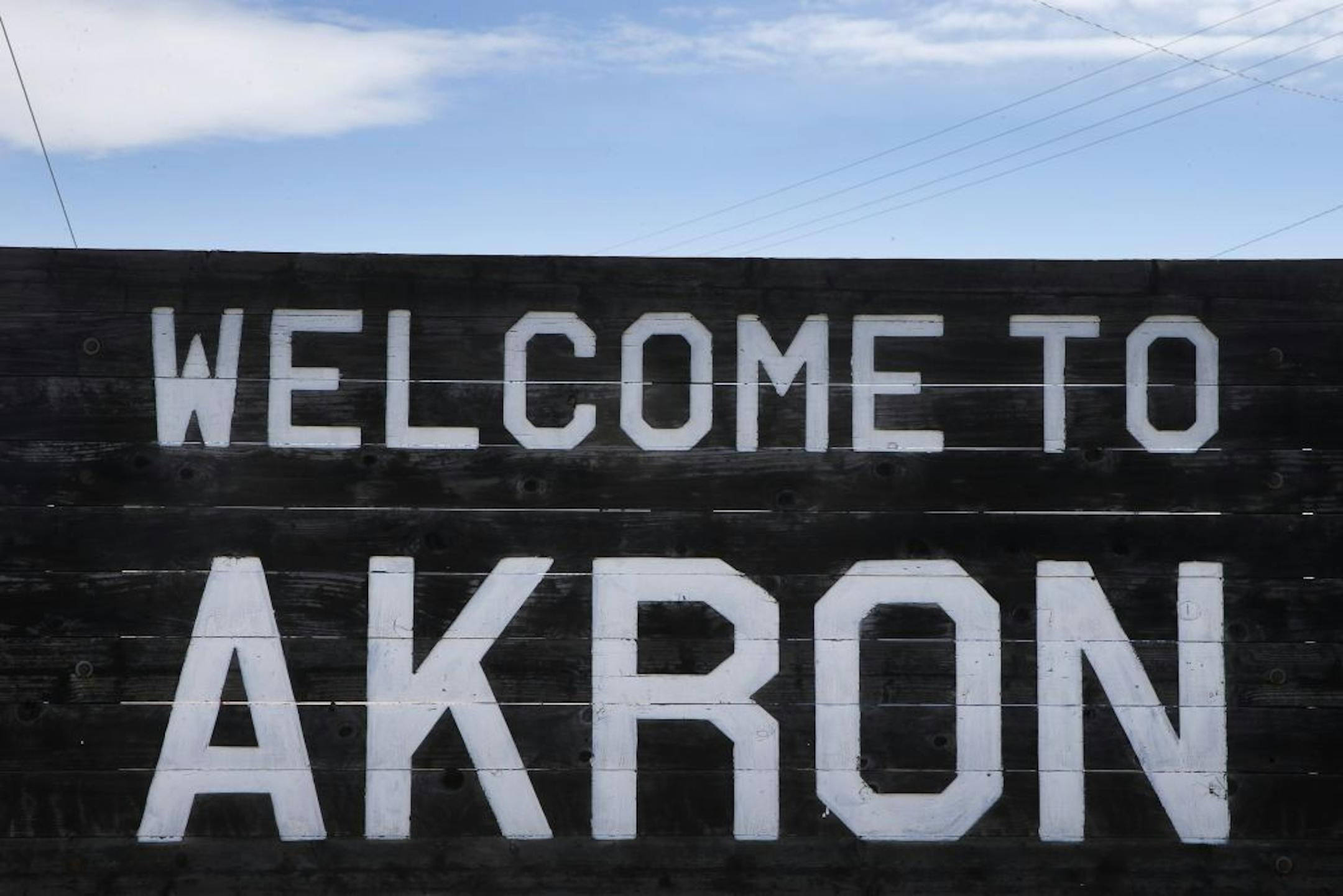 In this Nov. 6, 2013 photo, a sign welcomes visitors to the rural town of Akron, the county seat of Washington County, Colo. A day earlier, a majority in Washington and four other counties on Colorado�s Eastern Plains voted yes on the creation of a 51st state, largely over residents' alienation from voters statewide on issues such as civil unions for gay couples, new renewable energy standards, and limits on ammunition magazines.