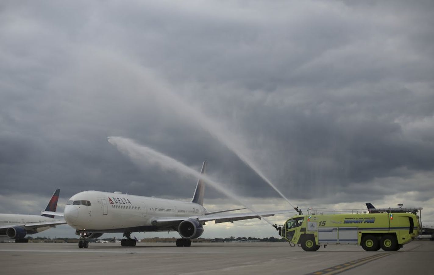 Water cannons saluted Delta Flight 90 as it taxied away from the terminal for the first scheduled service to Rome on Wednesday afternoon.