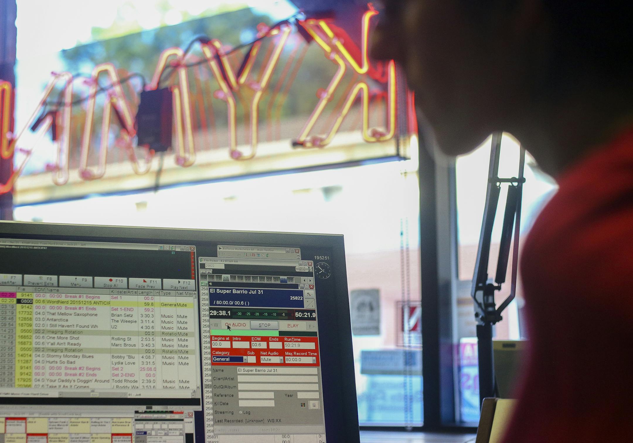 Mar Valdecantos, right, reviews the show recording software during an intemission. ] Timothy Nwachukwu &#x2022; timothy.nwachukwu@startribune.com Radio show "El Super Barrio Latino" goes live at KYMN Radio on Sunday, July 31, 2016 in Northfield. The show began in February 2016 to create a sense of community for Latinos in the Northfield area.