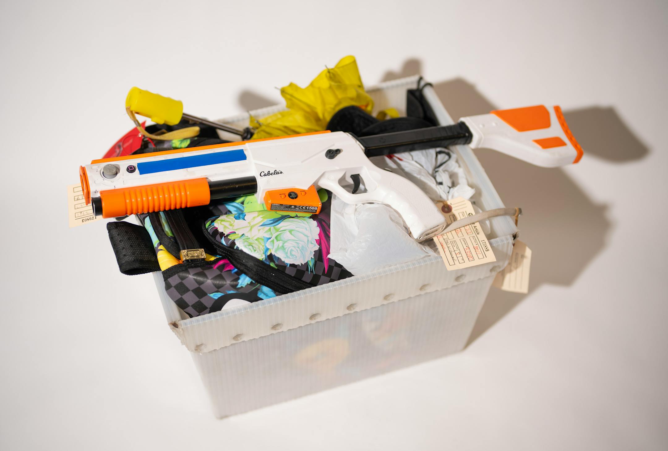 A bin of miscellaneous objects left behind on Metro Transit vehicles recently, photographed in the Lost and Found room.