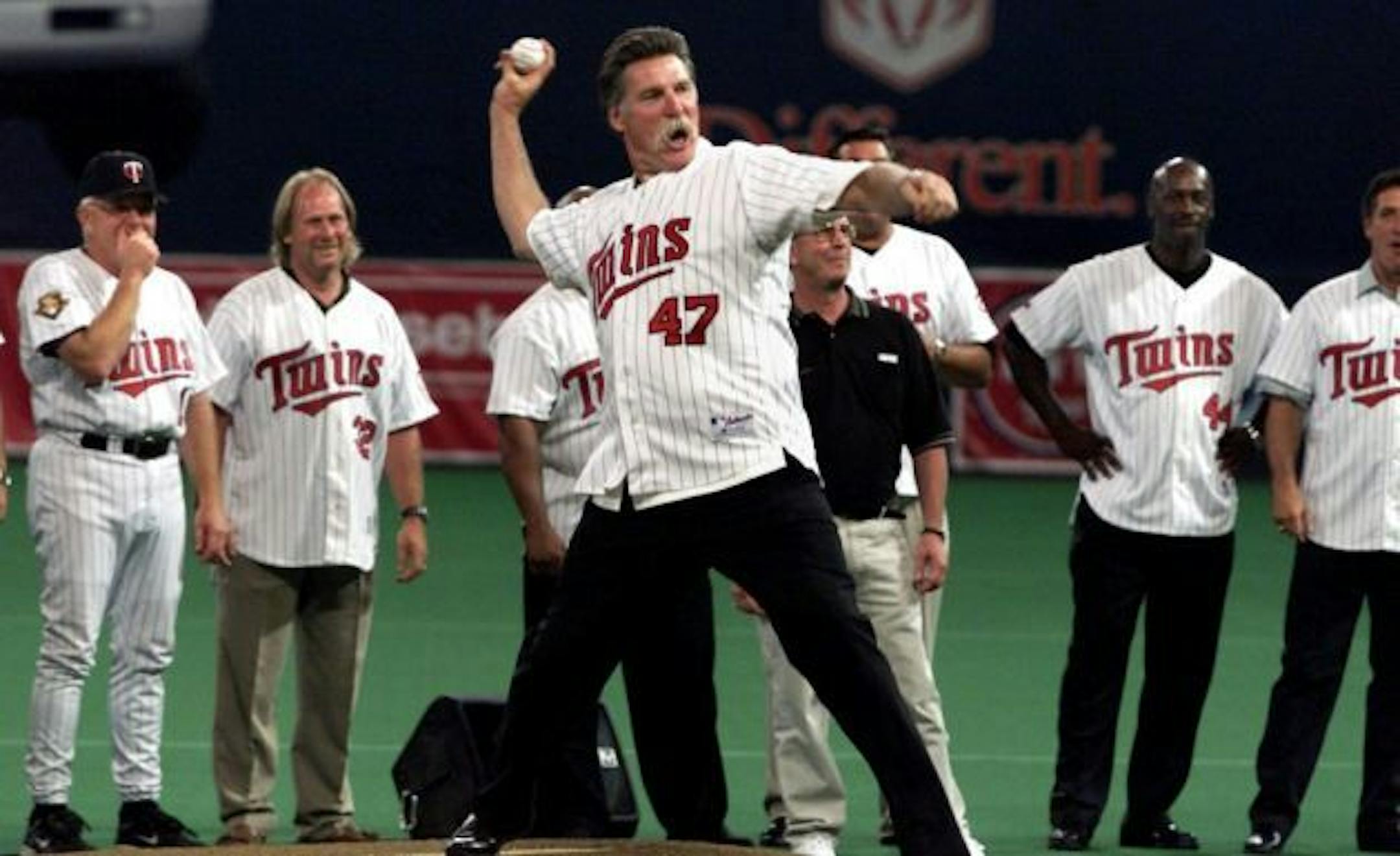 Jack Morris takes to the mound one more time, throwing out the ceremonial first ball before the Twins game with Detroit.  The championship team of 1991 was honored in pre-game festivities with manager Tom Kelly, Dan Gladen, and Chilli Davis recognisable in the background.