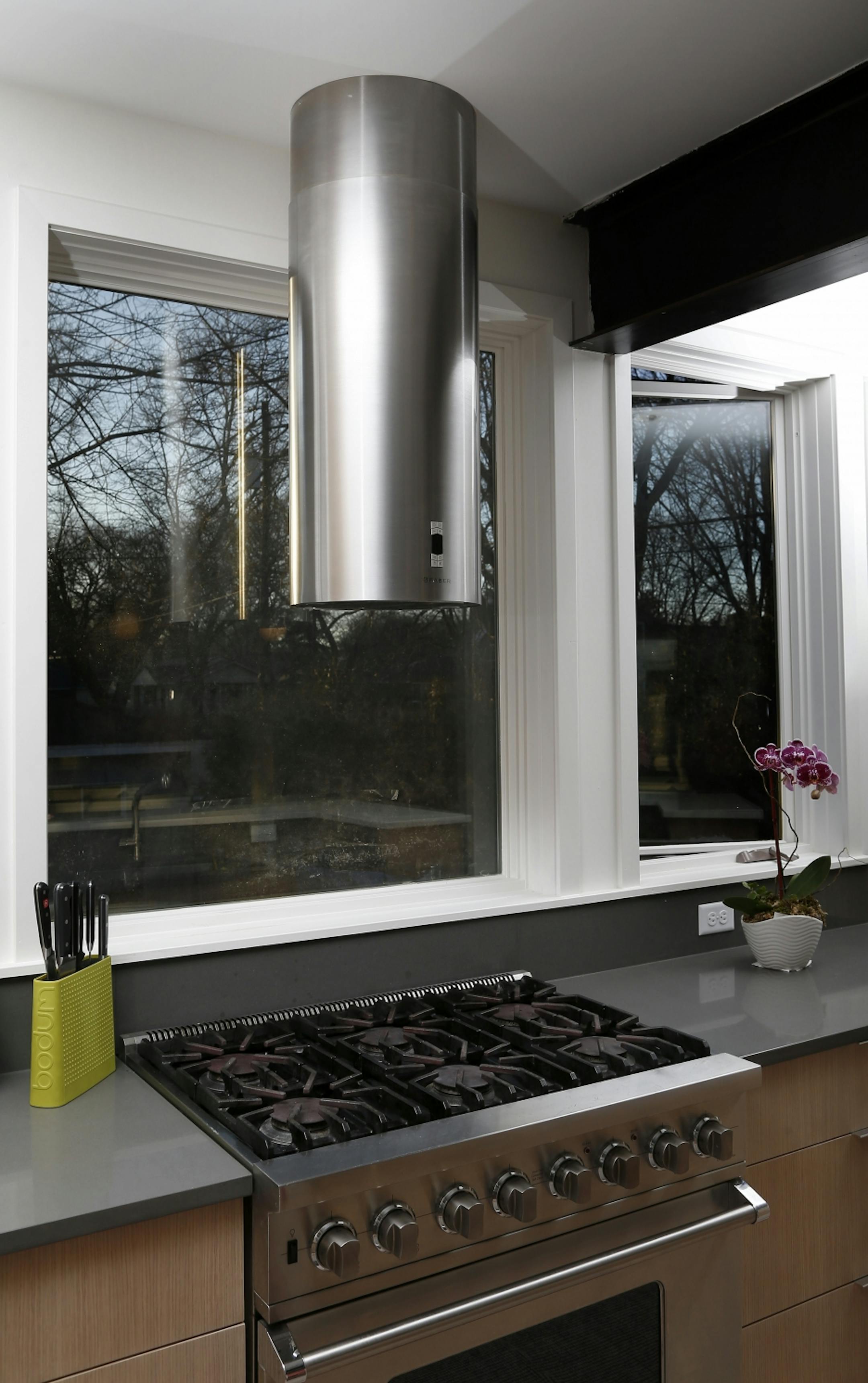 A sleek vent adds to the clean-lined, modern look in the kitchen.