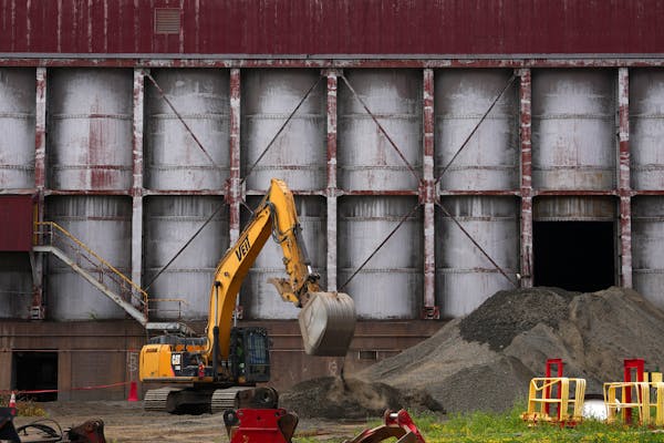 Crews work to remove fine crushed taconite ore from the mill Thursday, July 6, 2023 at the PolyMet processing site in Hoyt Lakes, Minn.