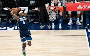 Timberwolves forward Jaden McDaniels heads in all alone for a dunk in the third quarter Thursday.