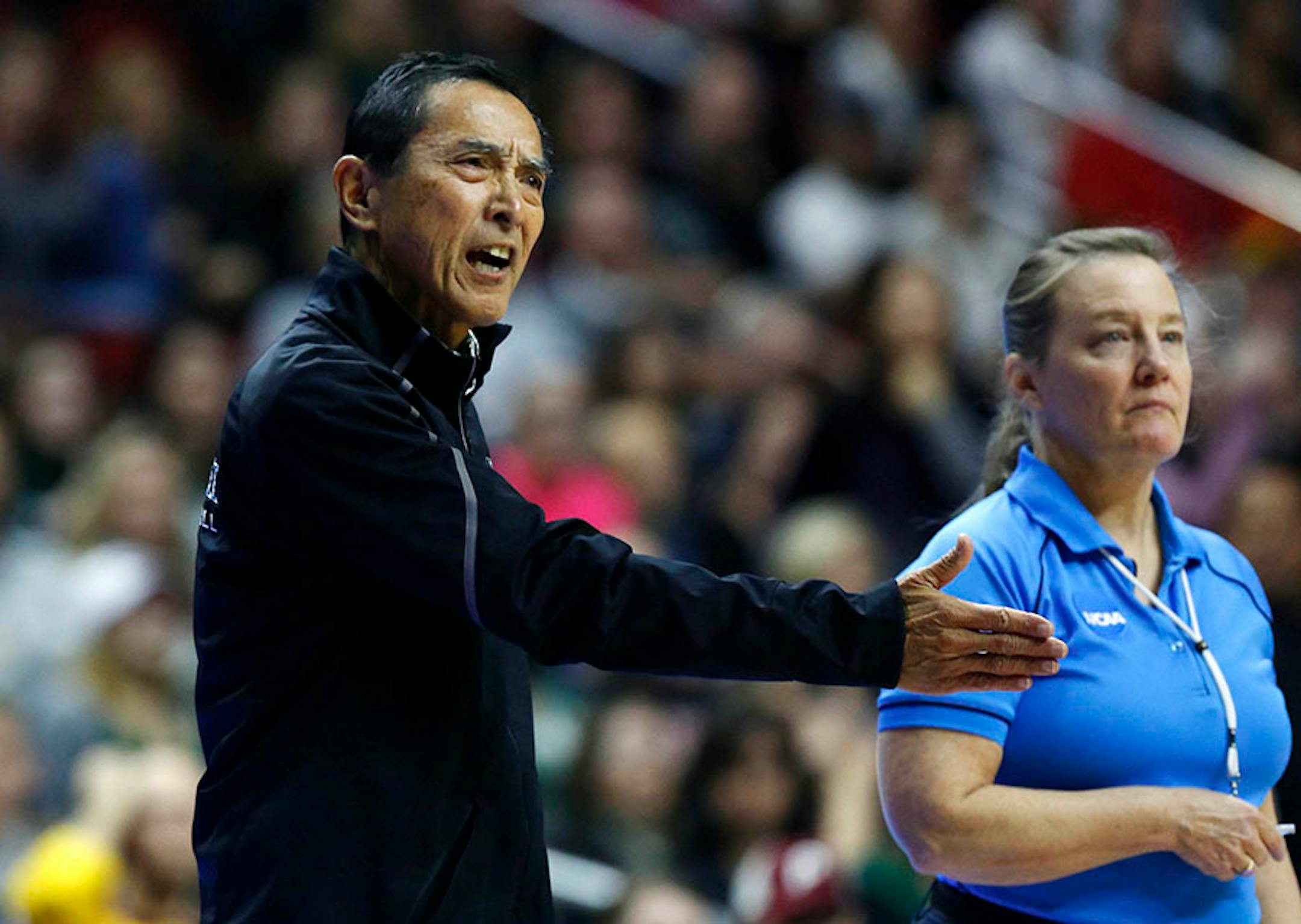 Hawaii head coach Dave Shoji questions a call Saturday, Dec. 12, 2015, during the NCAA Division I Women's Volleyball Championship in Des Moines, Iowa. (The Des Moines Register, Michael Zamora/The Des Moines Register via AP)