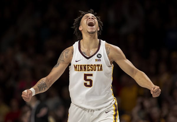 Amir Coffey (5) celebrated after making a three pointer late in the second half. Coffey had a career high 32-points.