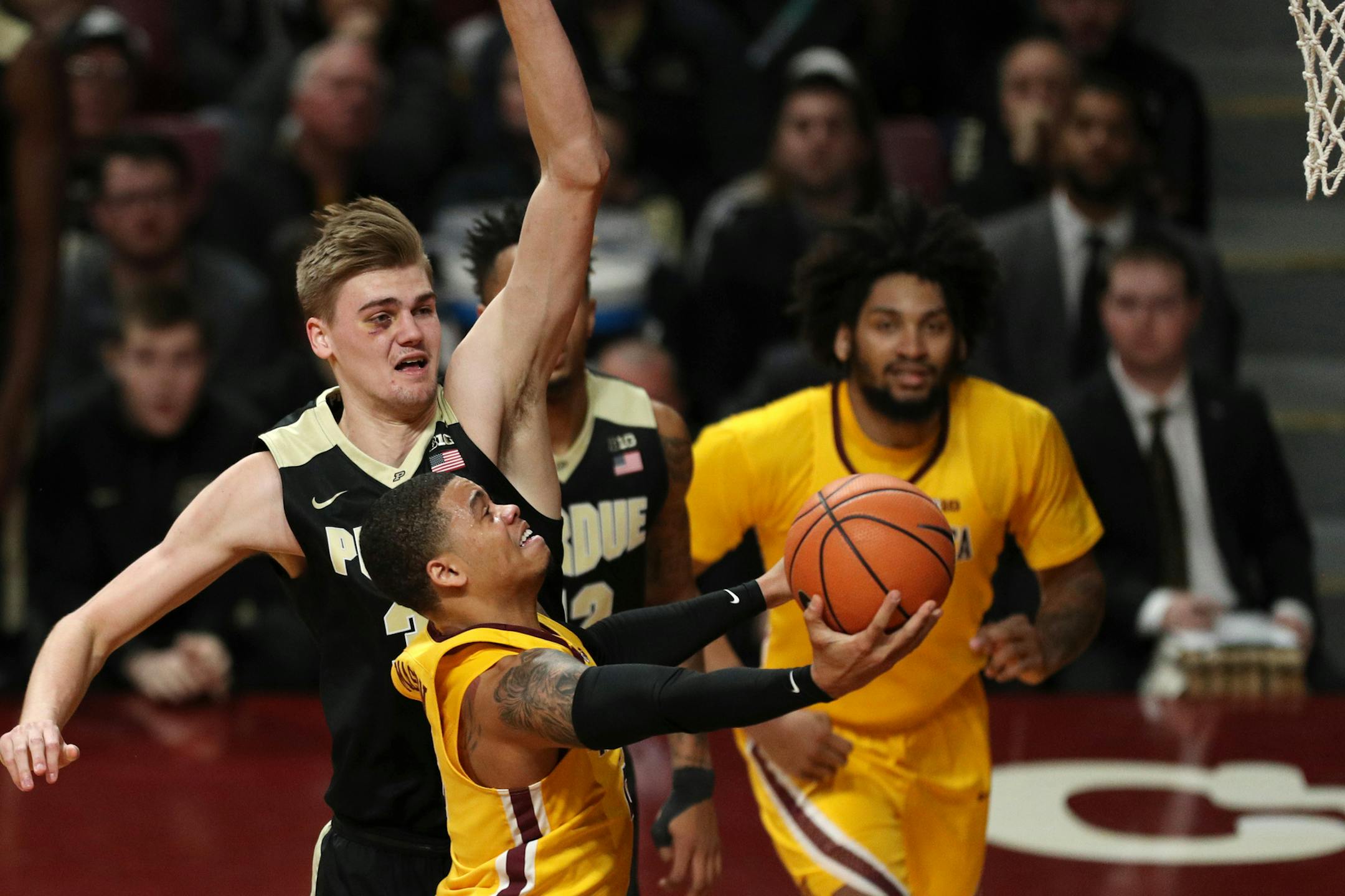 Minnesota Golden Gophers guard Nate Mason (2) went up for a shot as Purdue Boilermakers forward Matt Haarms (32) reached to swat the ball away in the first half. ] ANTHONY SOUFFLE ï anthony.souffle@startribune.com The Minnesota Golden Gophers men's basketball team played the Purdue Boilermakers Saturday, Jan. 13, 2018 at Williams Arena in Minneapolis.