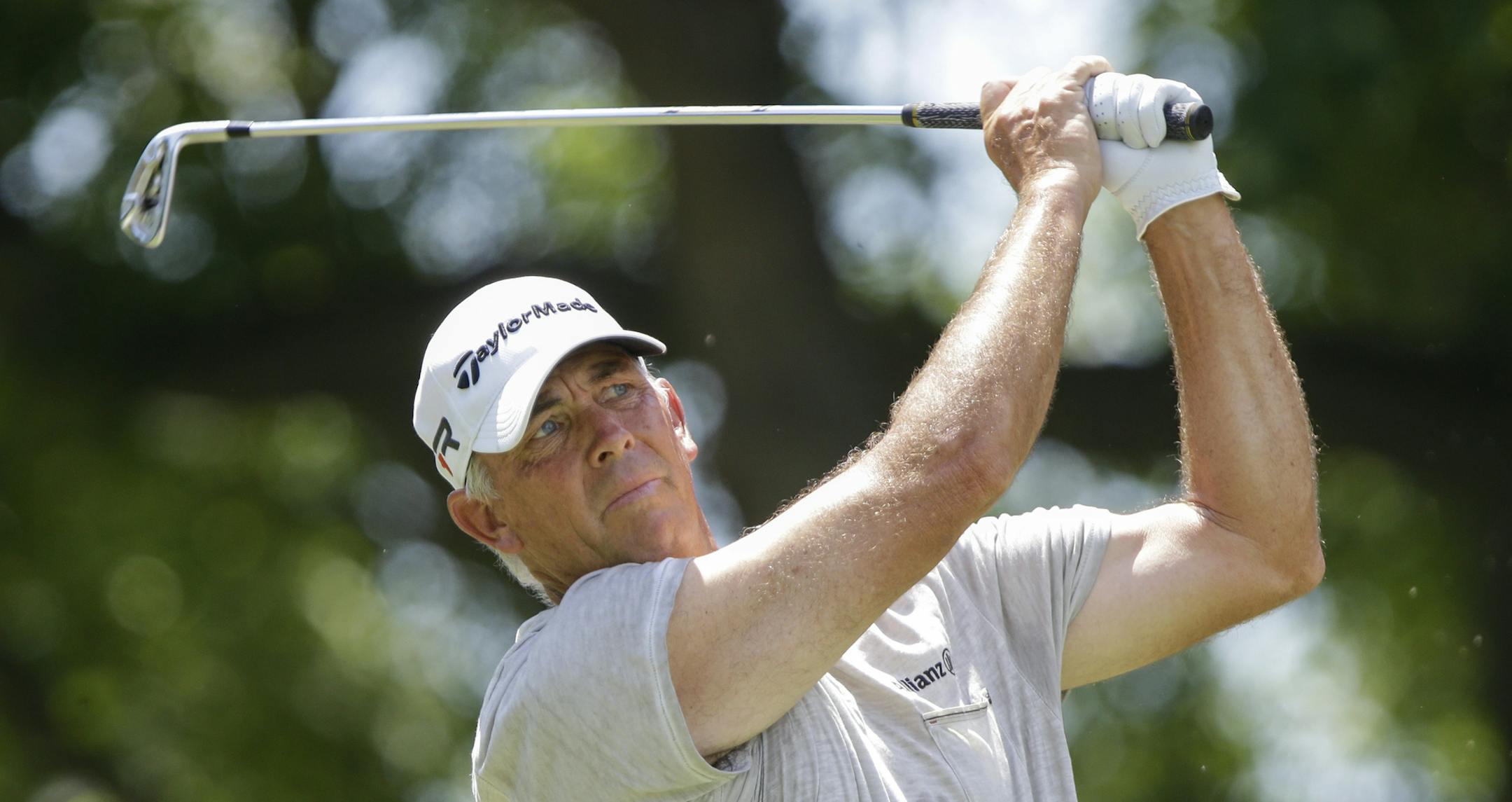 Tom Lehman tees off on the third hole Sunday, July 14, 2013, in the final round of the U.S. Senior Open golf tournament in Omaha, Neb. (AP Photo/Nati Harnik) ORG XMIT: MIN2013073119483187