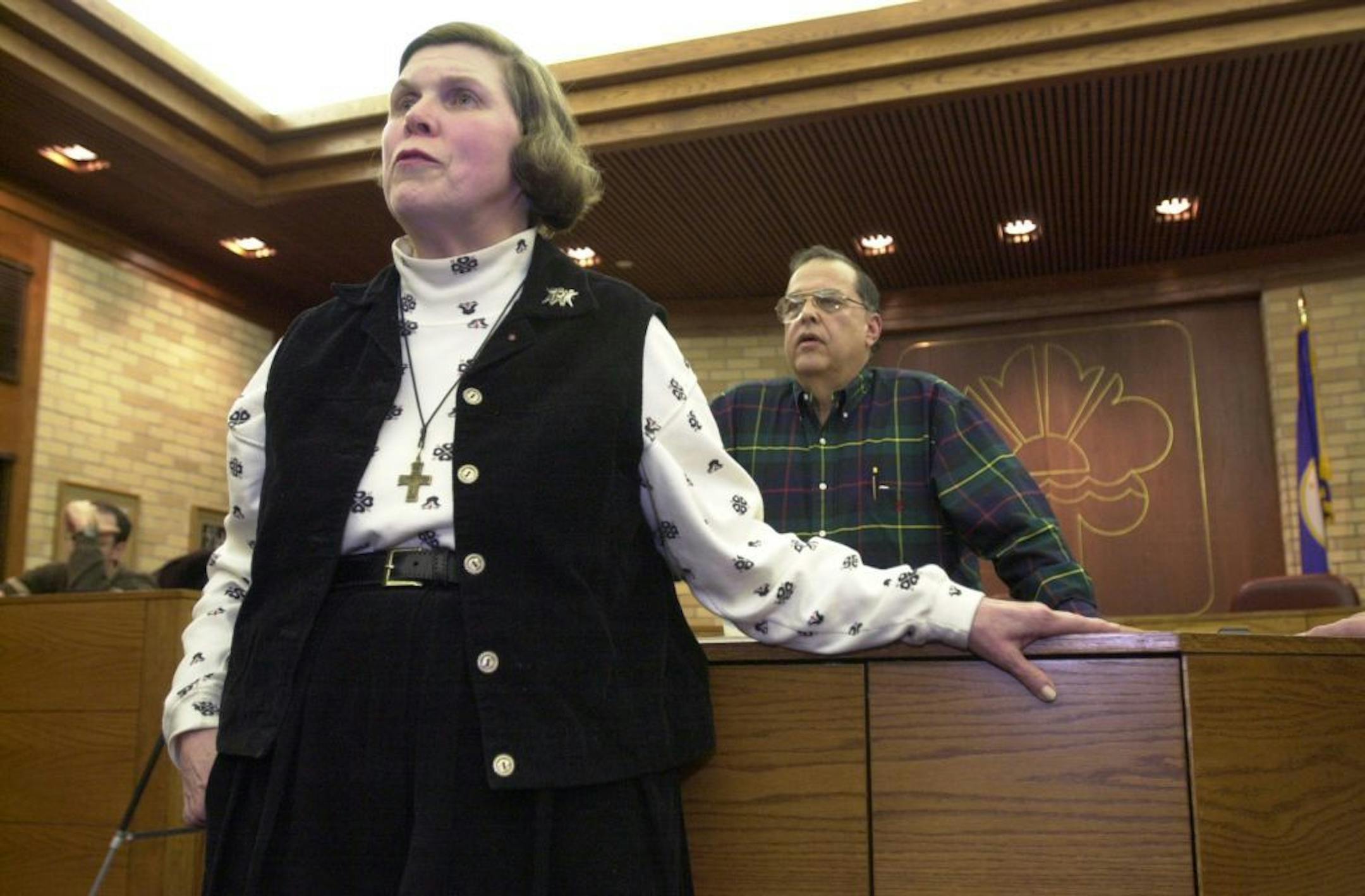 During an information meeting Wednesday evening (and with her husband Dick Copeland behind her), Mary Jo Copeland answers questions from residents of Chaska who will be affected by the building of Gift of Mary Children's Home.