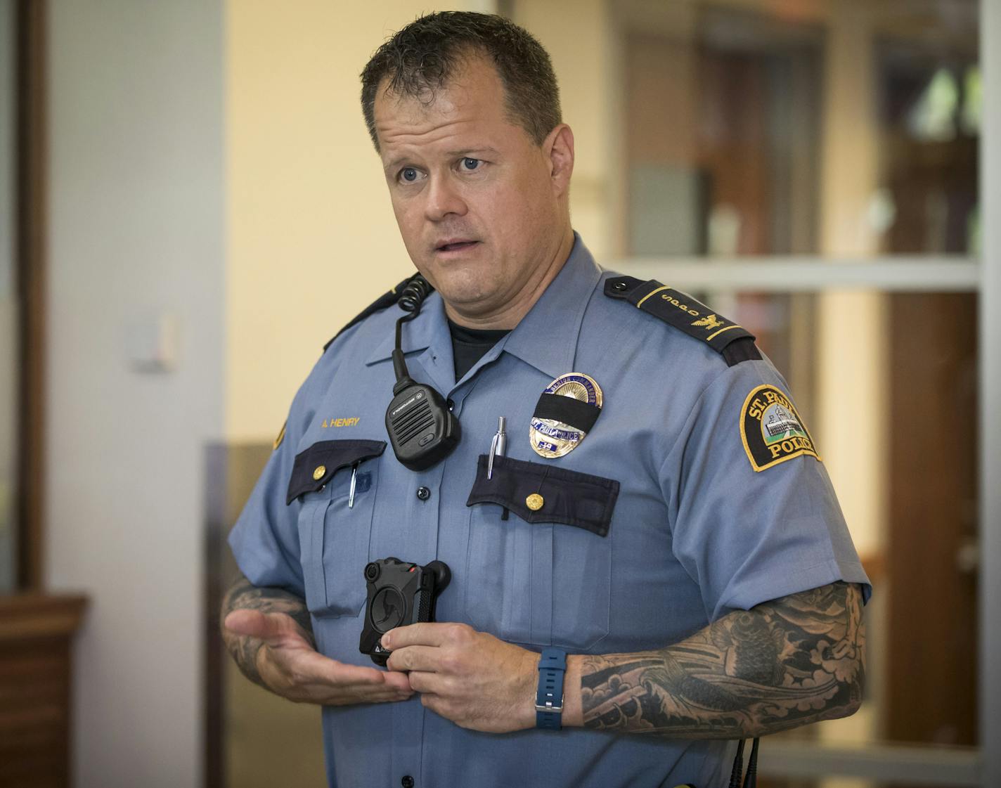 Senior commander Axel Henry demonstrated how to turn on the new body cameras during a press conference on the first day of training for the new body cameras on Tuesday, September 12, 2017, in St. Paul, Minn. ] RENEE JONES SCHNEIDER &#x2022; renee.jones@startribune.com