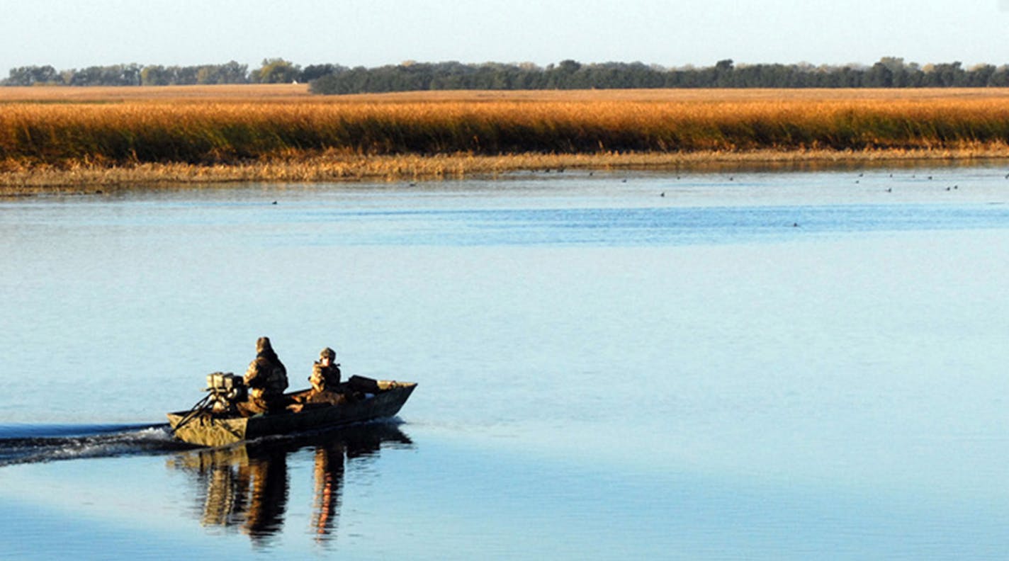 Dakotans say they can tell Minnesota duck hunters from locals because Minnesotans frequently travel by boat, as Dennis Anderson's sons did as teenagers, north of Aberdeen, S.D.