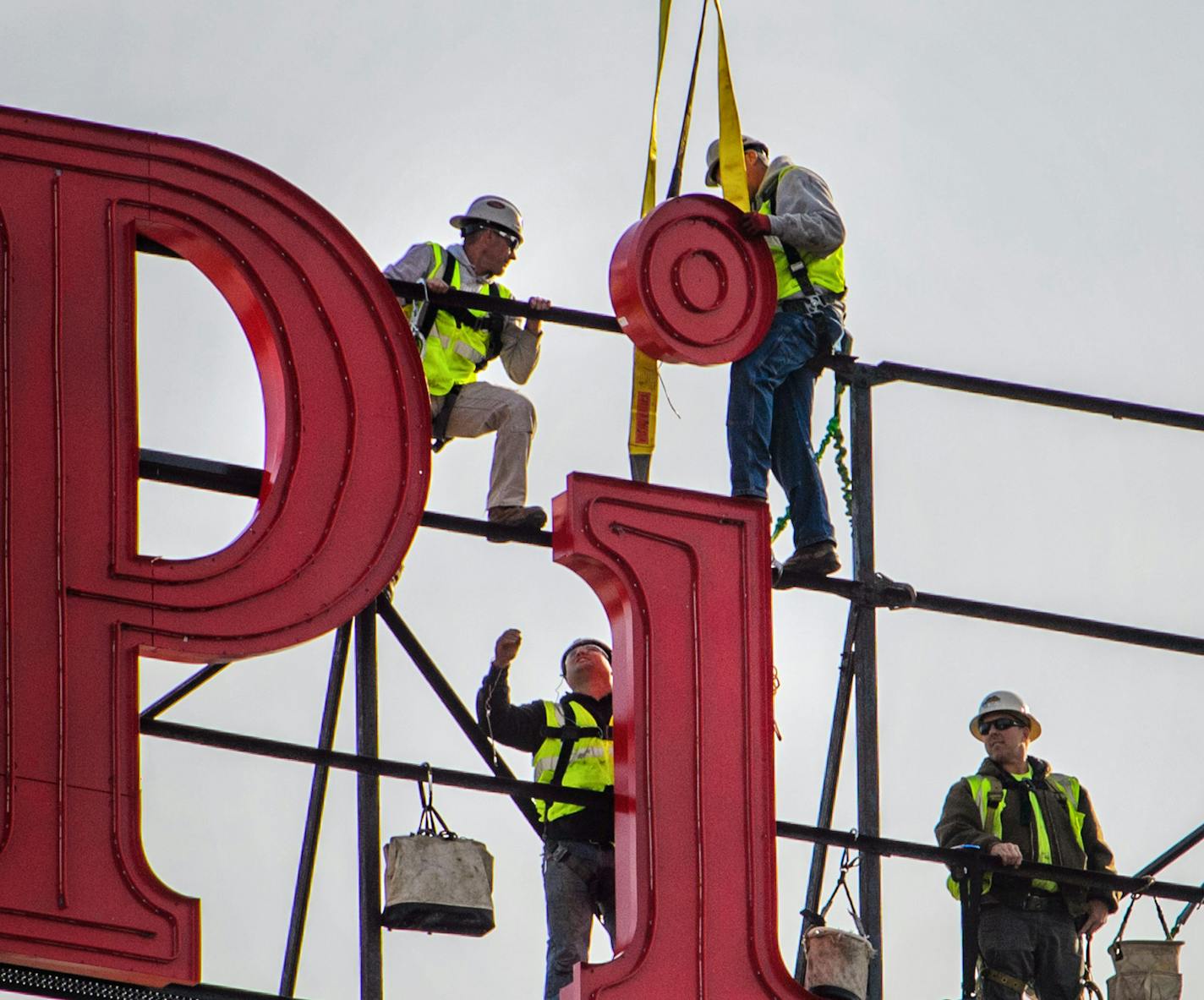 Worker from Lawrence Sign positioned the dot for the letter i. ] GLEN STUBBE * gstubbe@startribune.com Tuesday, October 20, 2015 The St. Anthony Main strip and A Mill Artists Lofts is getting its Pillsbury mojo back. Work is underway to reinstall the 30-foot tall Pillsbury's Best Flour sign, which sits atop a red tile silo building connected to the Pillsbury Mill. Owen Metz, of Twin Cities-based developer Dominium which is restoring the sign, said removing, restoring and replacing the signs with