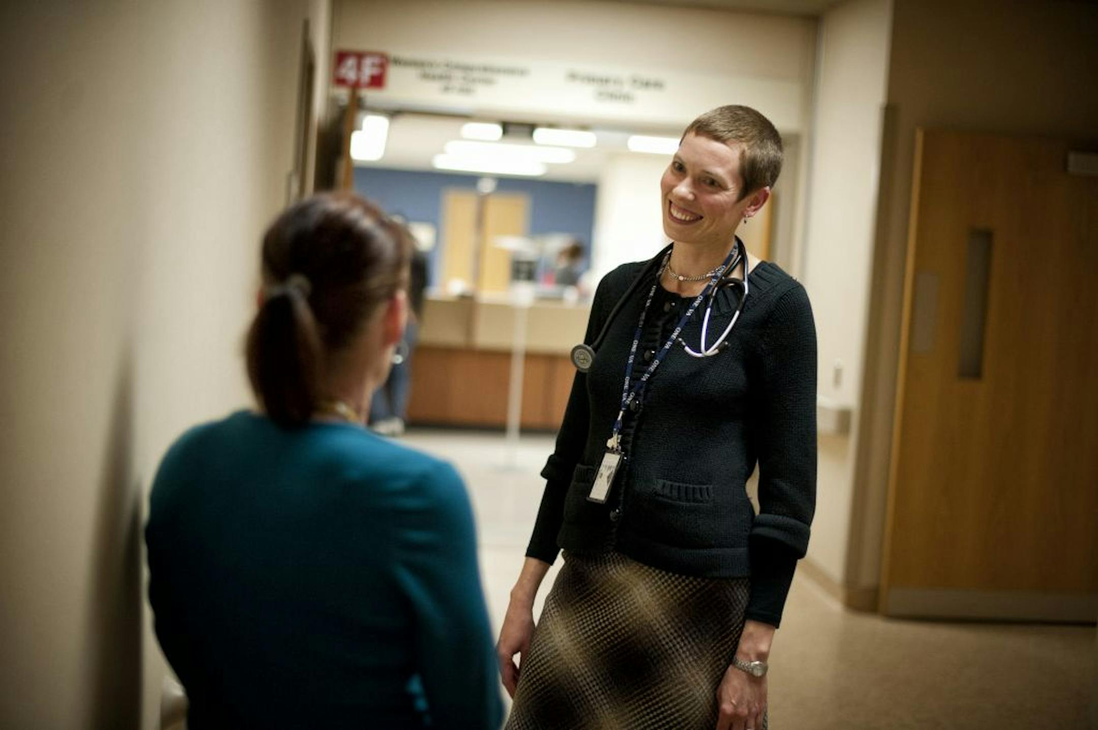 Dr. Erin Krebs, women's health director at the Minneapolis VA hospital talked with a worker about moving her desk and phones to be closer to the growing womens health center. The hospital was recently awarded $217,000 in grants to improve health care for women vets for projects that will improve emergency health care services for women Veterans, expand women�s health education programs for VA staff, and offer telehealth programs to female Veterans in rural areas.