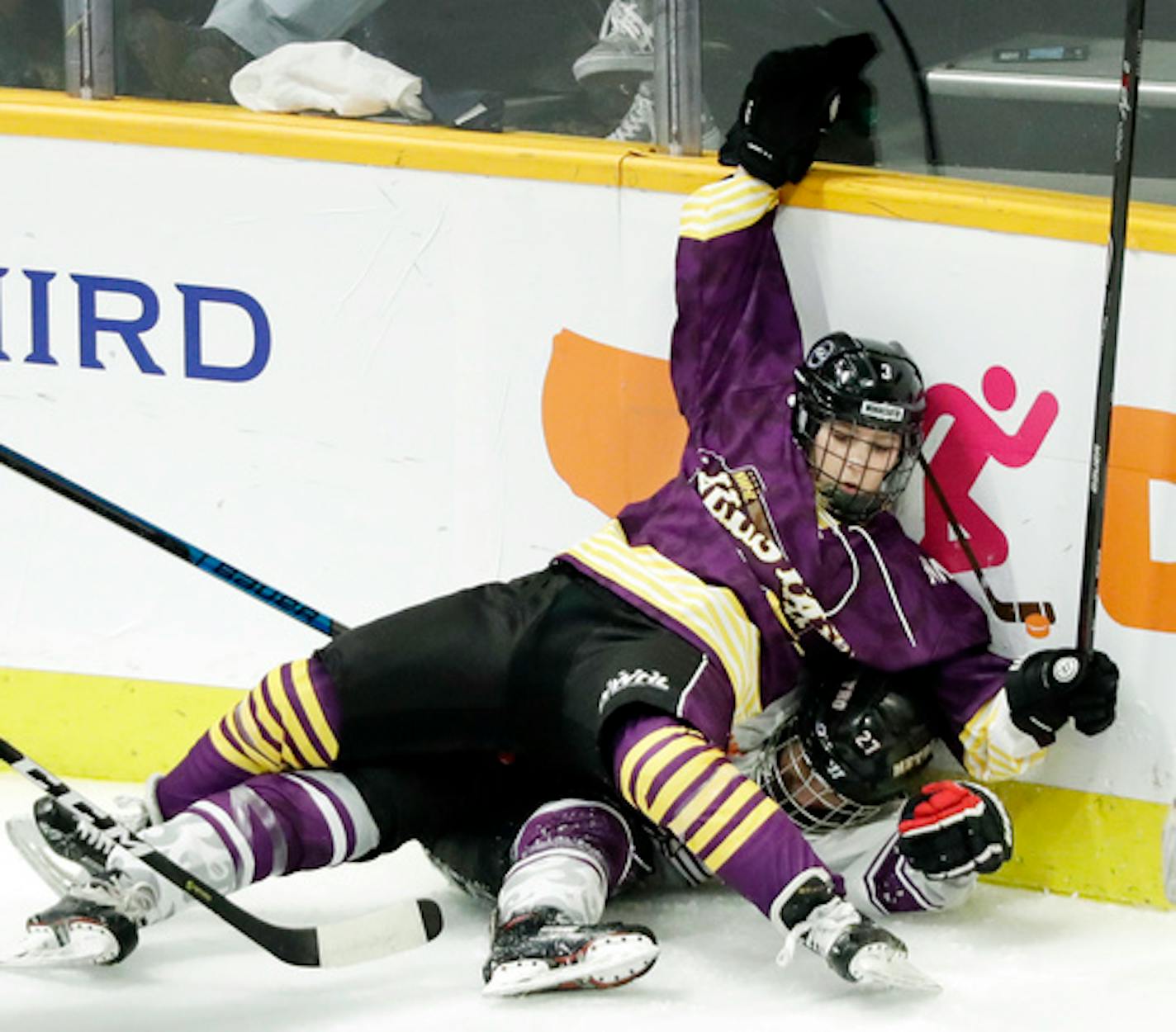 Jonna Curtis, top, a forward on Team Stecklein, battled for the puck with Michelle Picard, a defender on Team Szabados, during the NWHL All-Star Hockey Game Sunday, Feb. 10, 2019, in Nashville, Tenn.