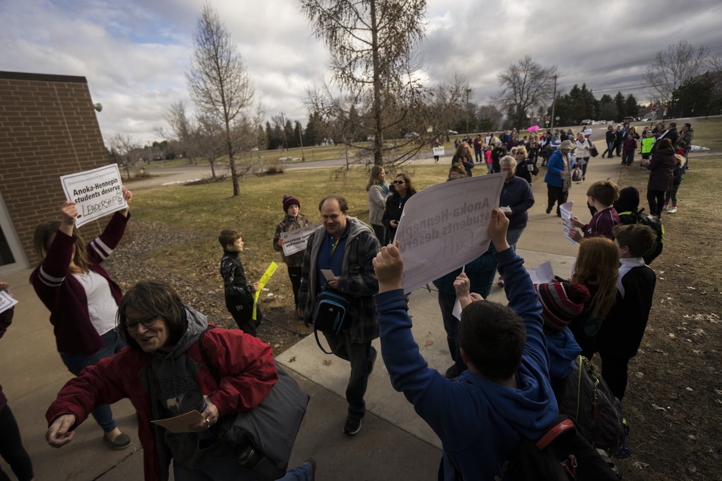 Students, parents and supporters made a tunnel of support for faculty as they entered the school on Thursday, April 18, 2018 outside of Ramsey Elementary School in Ramsey, Minn.