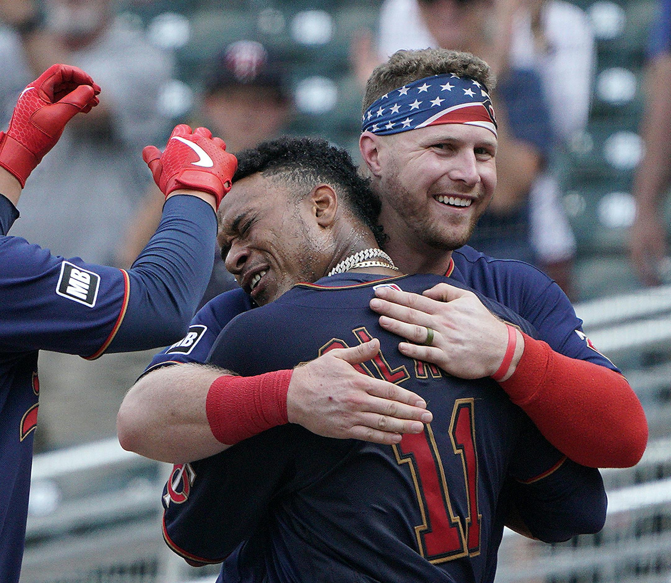 Minnesota Twins' Jorge Polanco, gets a big hug from catcher Ryan Jeffers after his bases-loaded, walk off single drove in the winning run in the 11th inning as the Twins beat the Cleveland Indians 8-7.